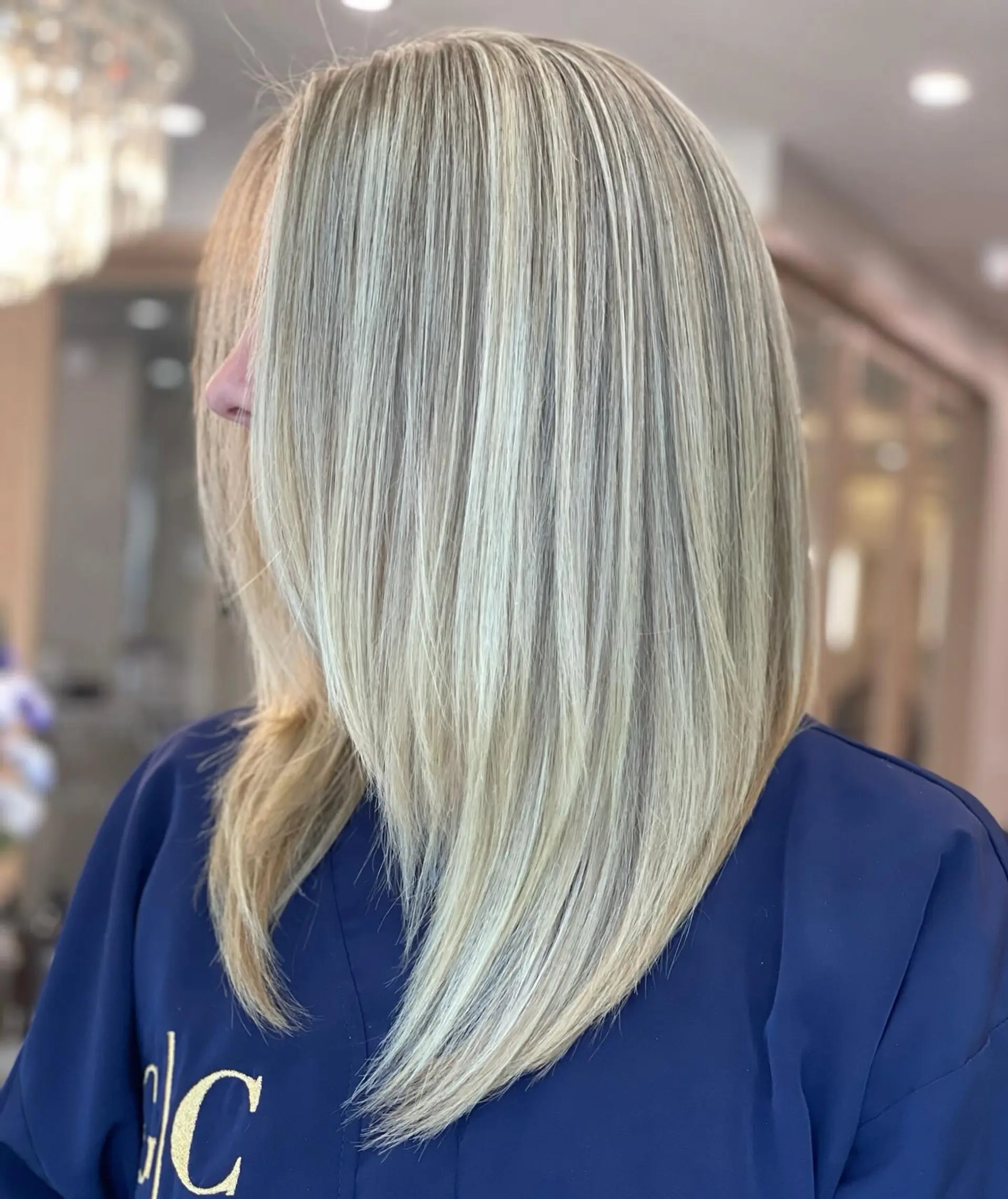A stylish layered lob with a cool-toned icy blonde color. 1