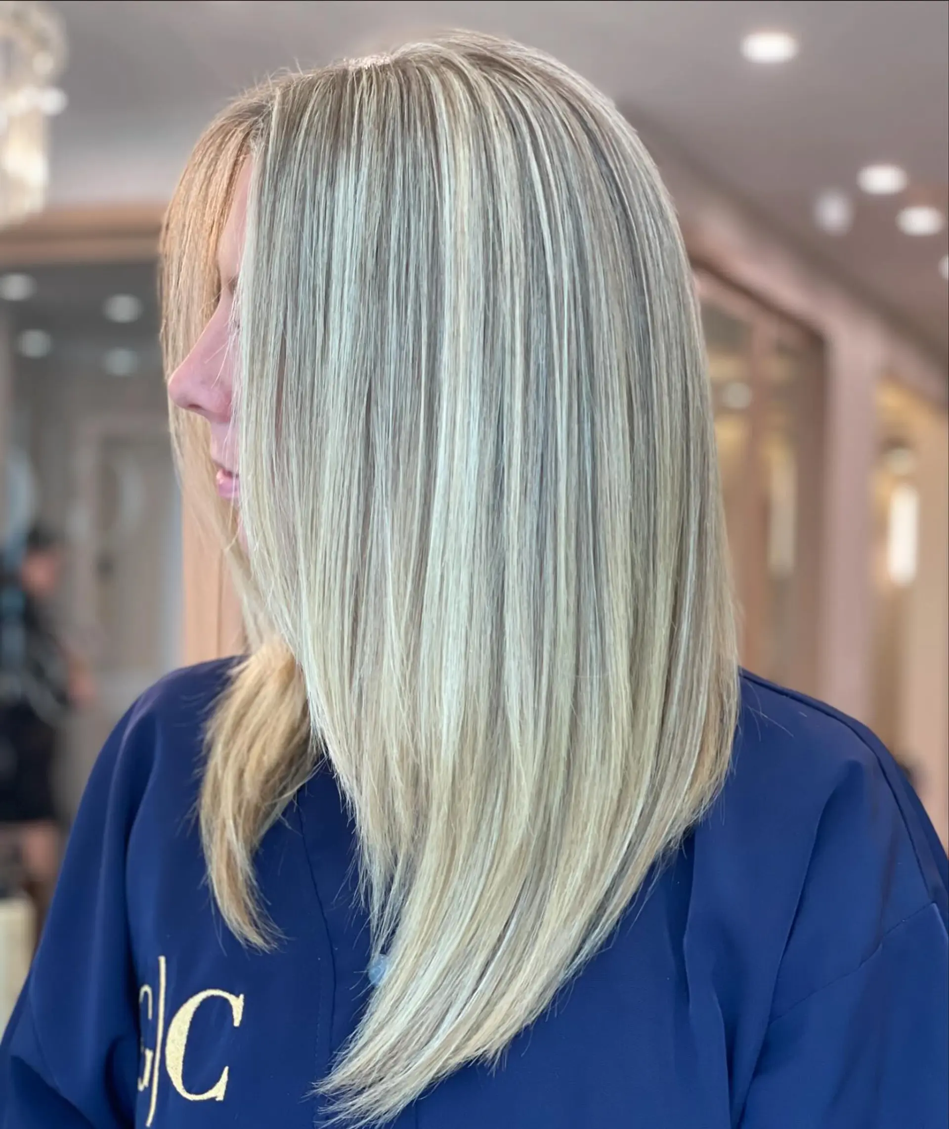 A stylish layered lob with a cool-toned icy blonde color. 2