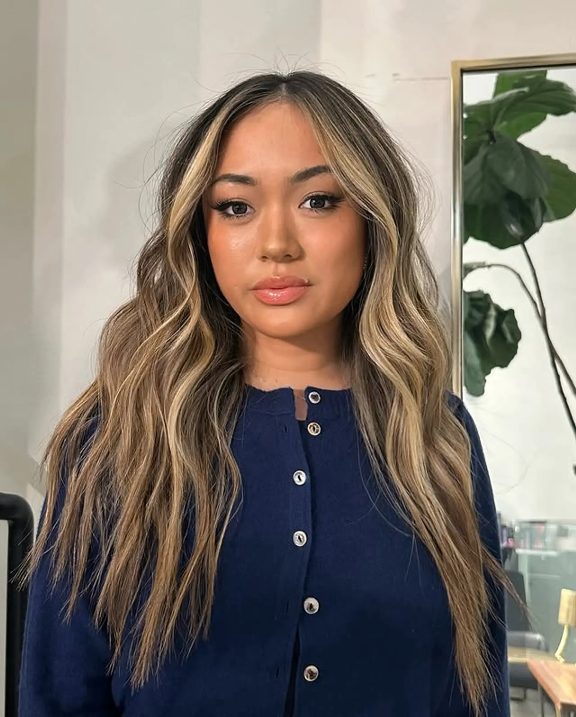 Long, wavy hair with face-framing blonde highlights and balayage. 1