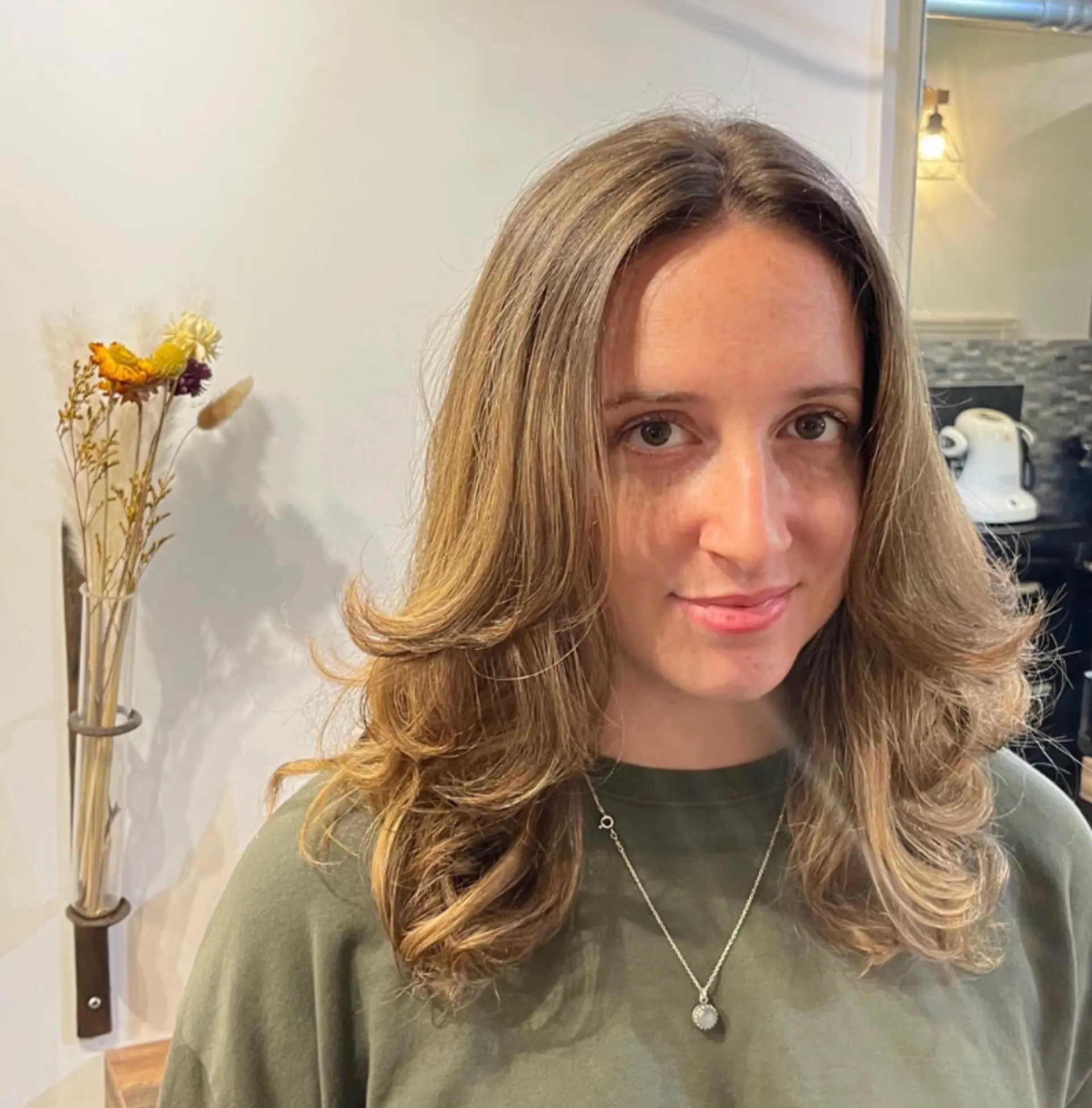 A medium-length layered style with a bouncy blowout. 1