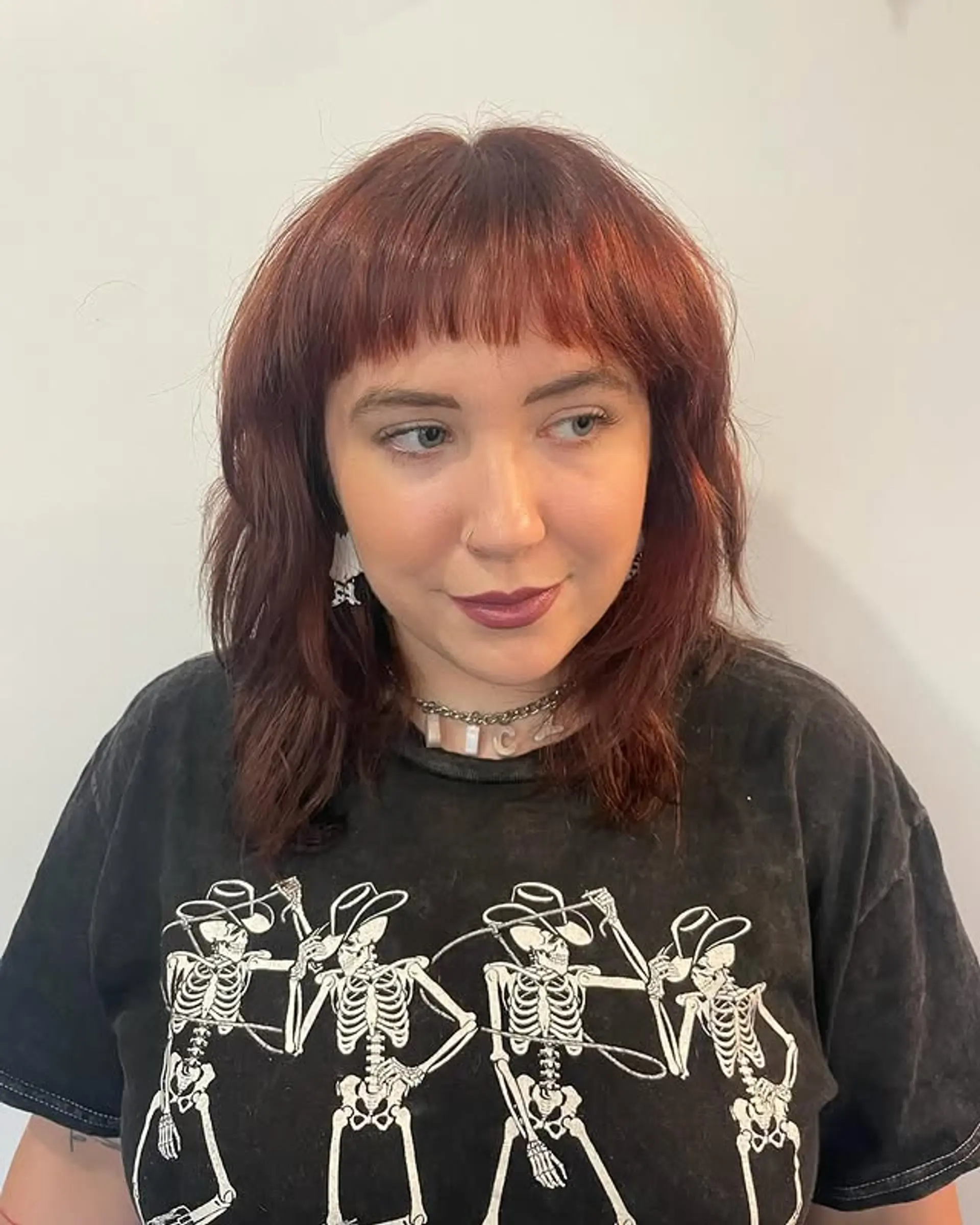 A medium-length shag with baby bangs and lots of layers and texture. 1