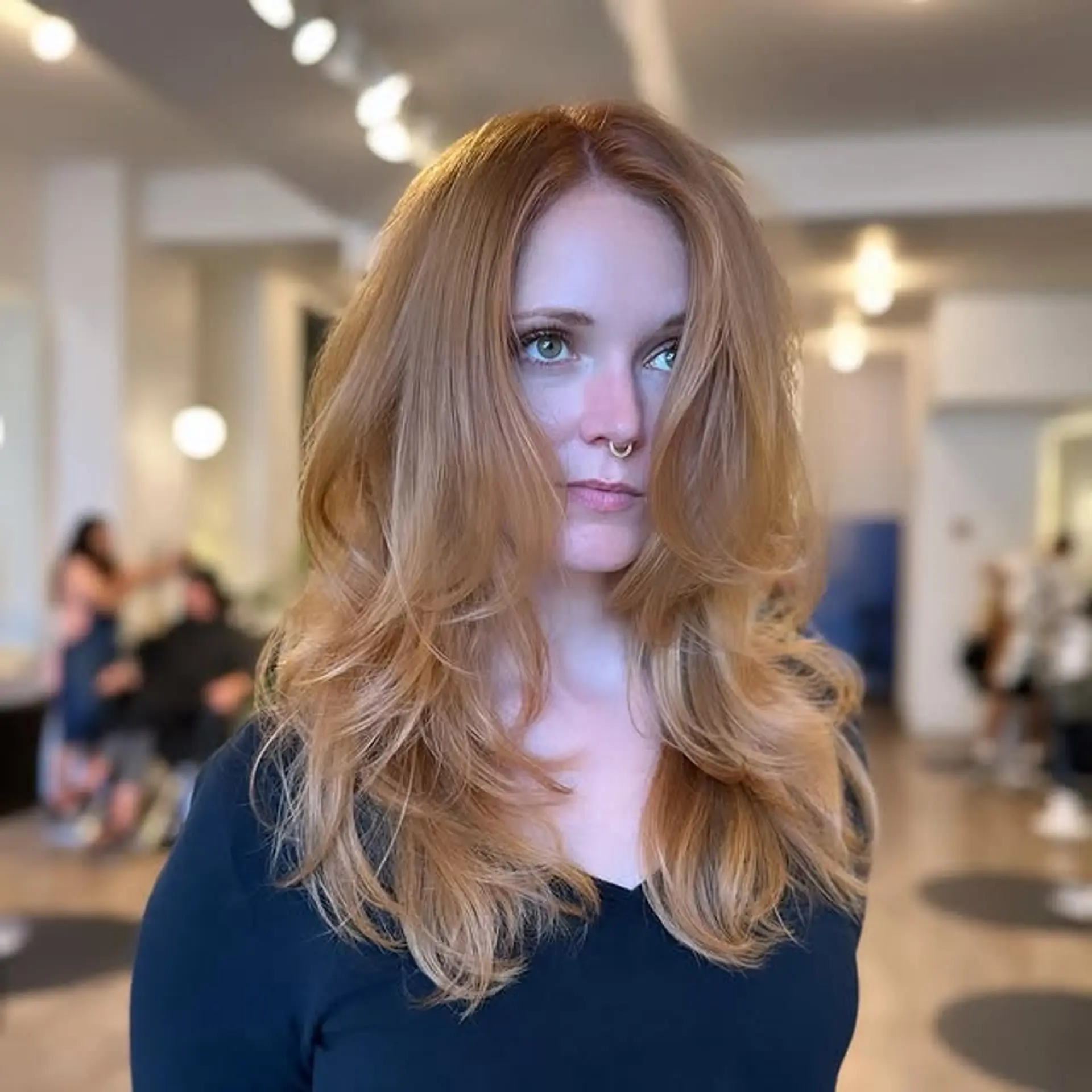 A long, wavy layered haircut with face-framing layers for added dimension. 1