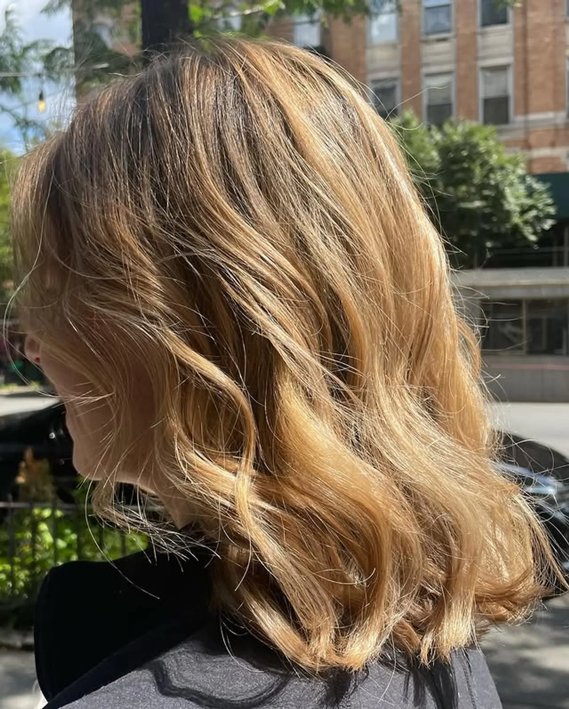 A medium-length wavy hairstyle with subtle, natural-looking waves. 1