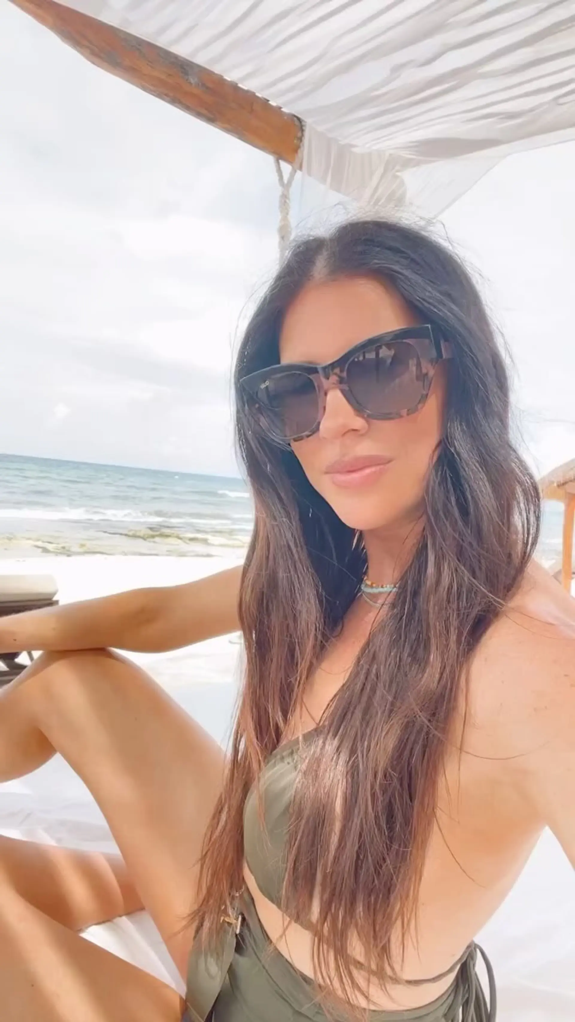 Very long brunette hair with soft beachy waves. Source credits color to Cory Aaron Scott and extensions to @merikateoconnor. 1