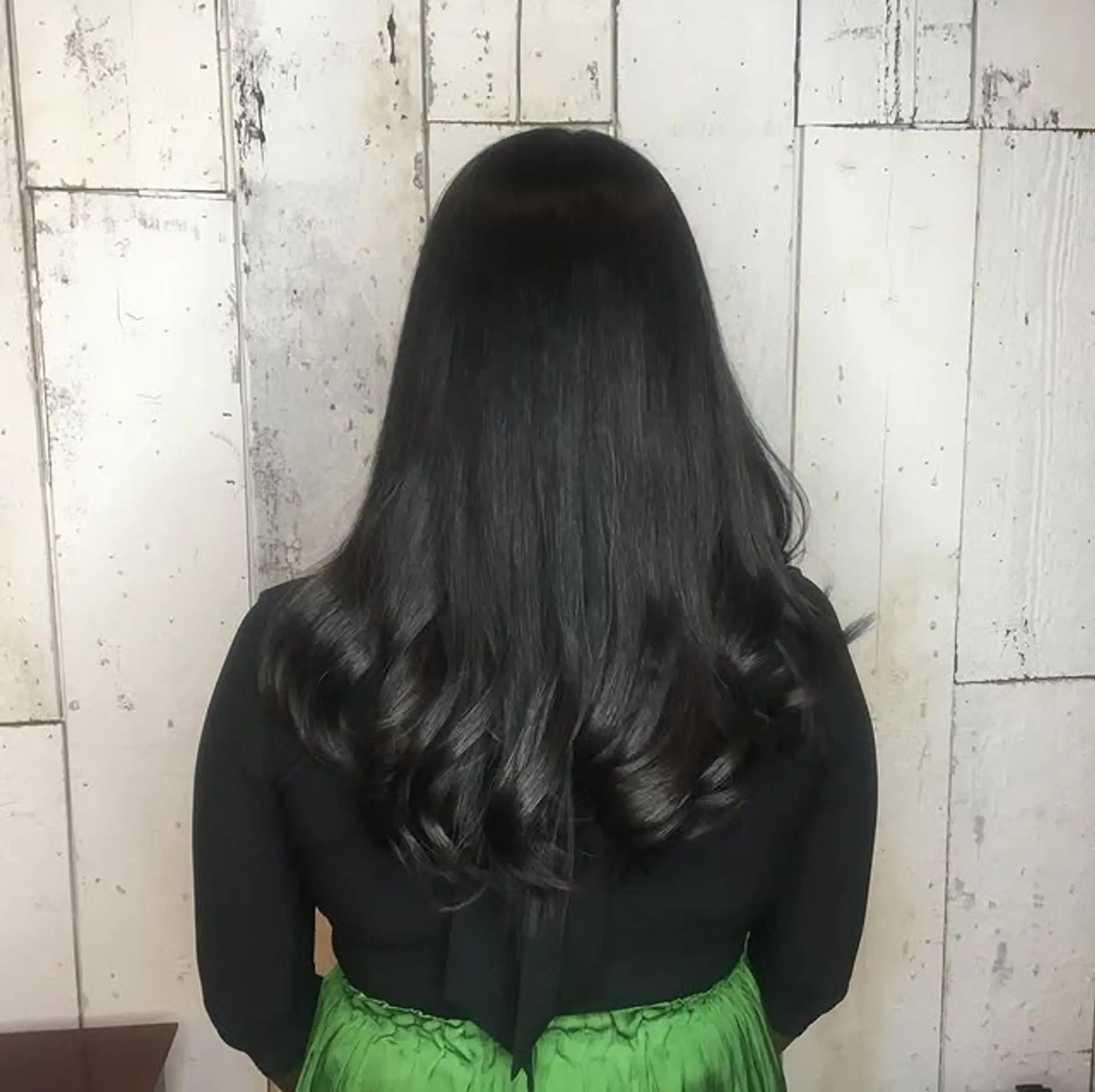 Long layered hairstyle with soft, elegant waves. 1