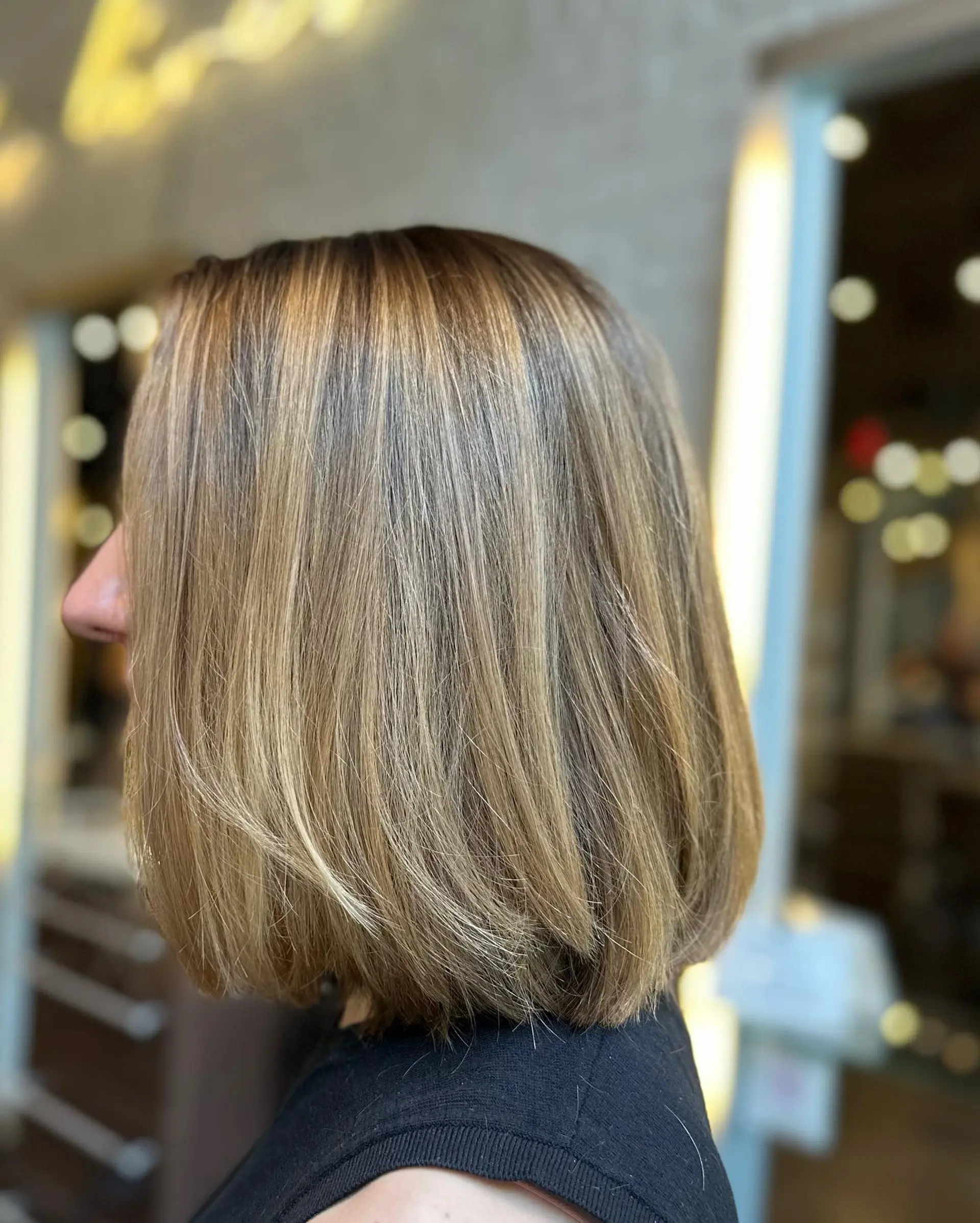 A chic, medium-length blunt bob with highlights. 1