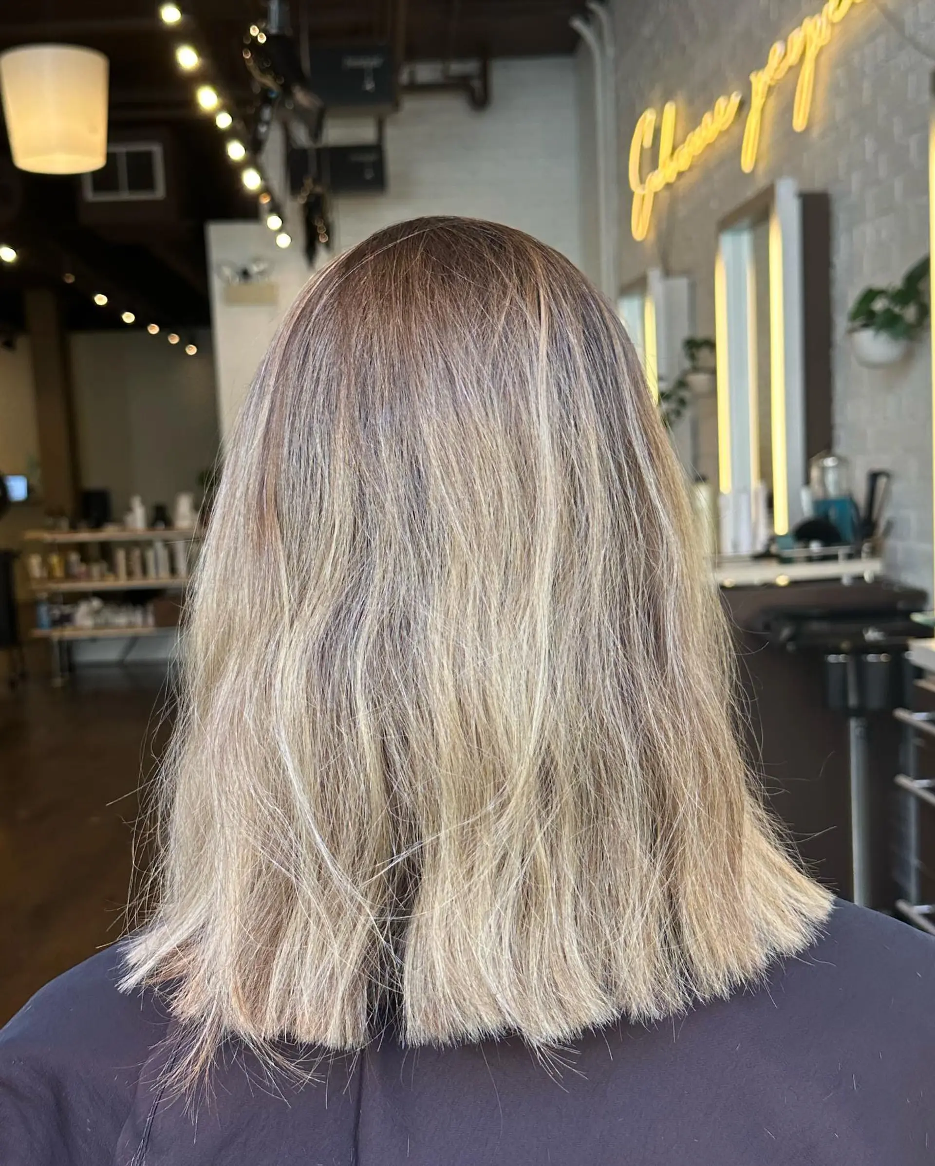 A chic, medium-length blunt bob with highlights. 2