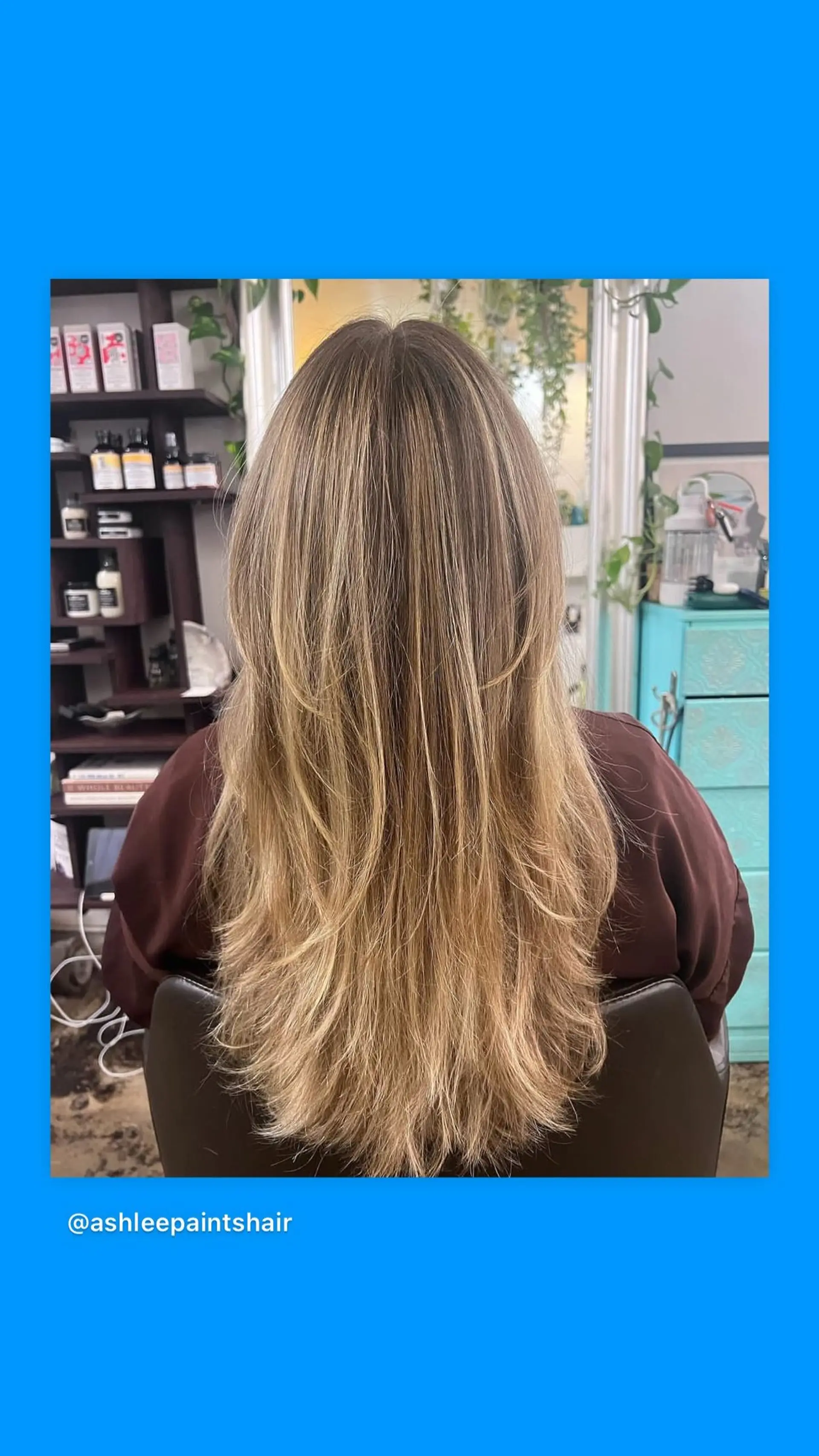 A long layered haircut with dimensional blonde highlights. 1