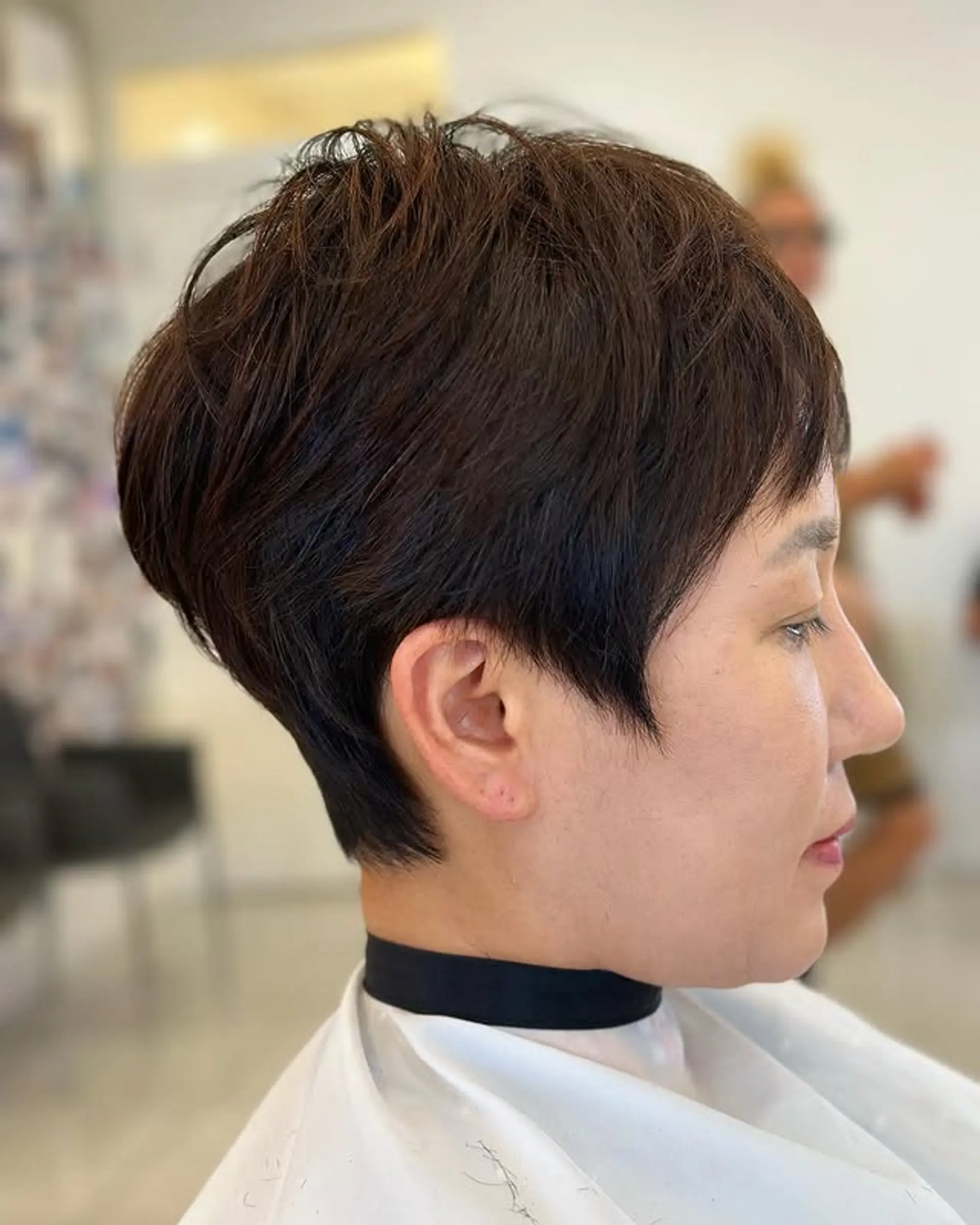 This is a short, layered pixie crop haircut with texture. 1