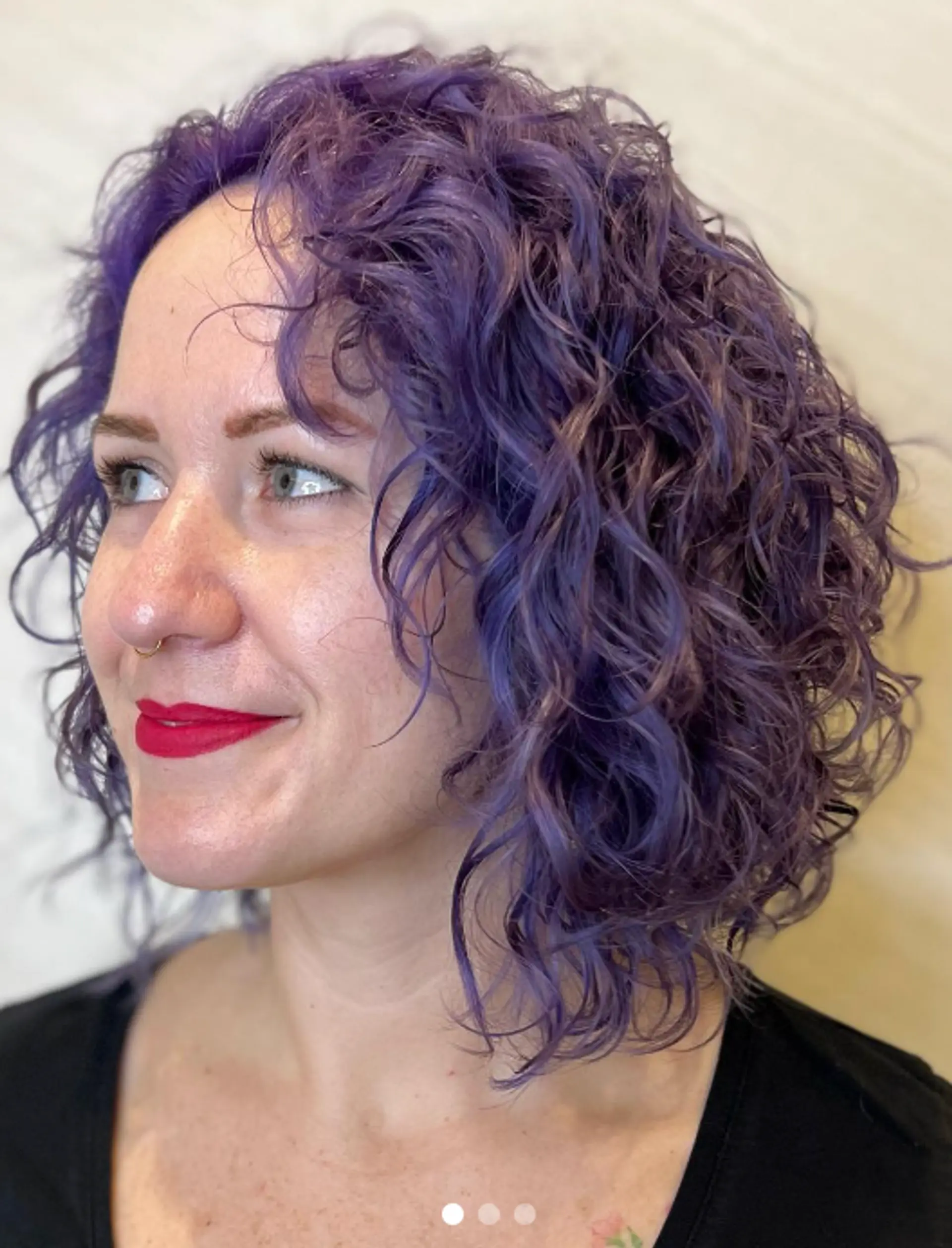 Medium-length curly hairstyle with bold purple color and well-defined curls.

Color by @simabeautynyc
Cut and style by @juliamannino_hair
 2