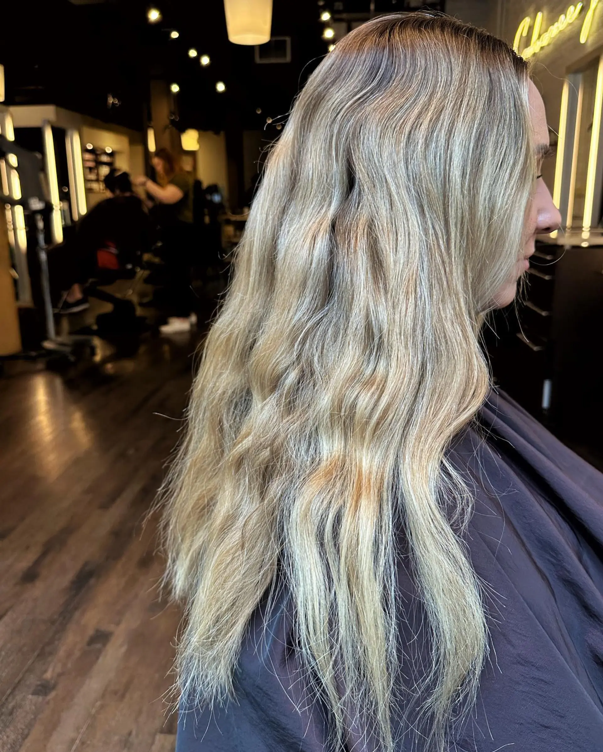 Long, straight layered hair with a bronde balayage. 2