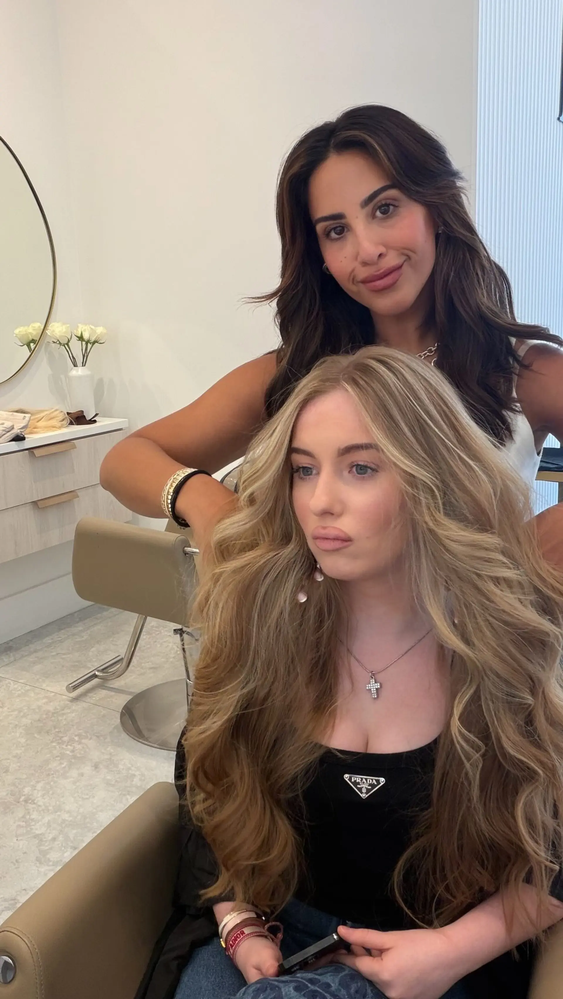 Voluminous long waves with soft, sun-kissed face-framing blonde highlights. 1