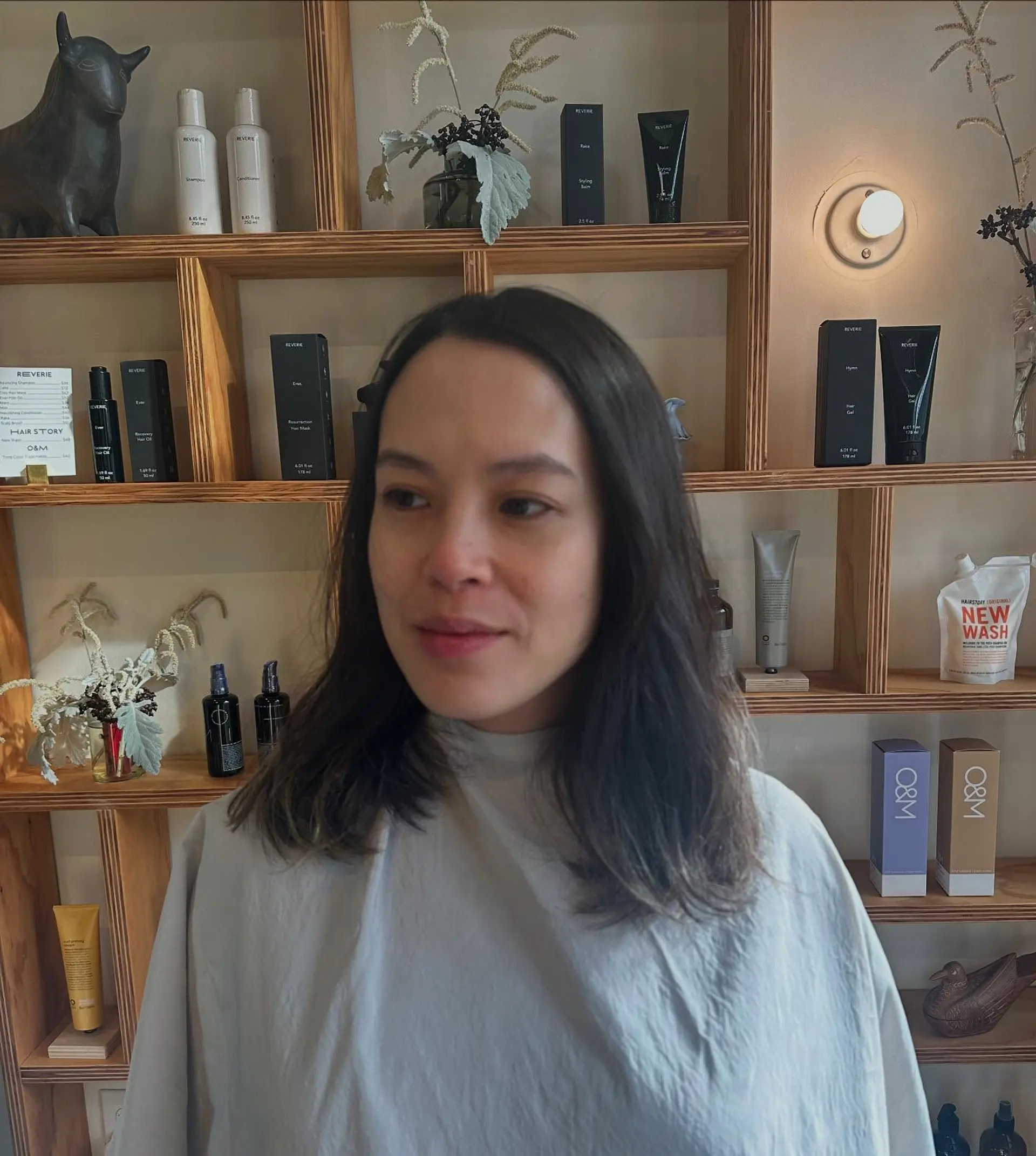 A shoulder-length dark brown haircut with a middle part and soft, natural ends. 1