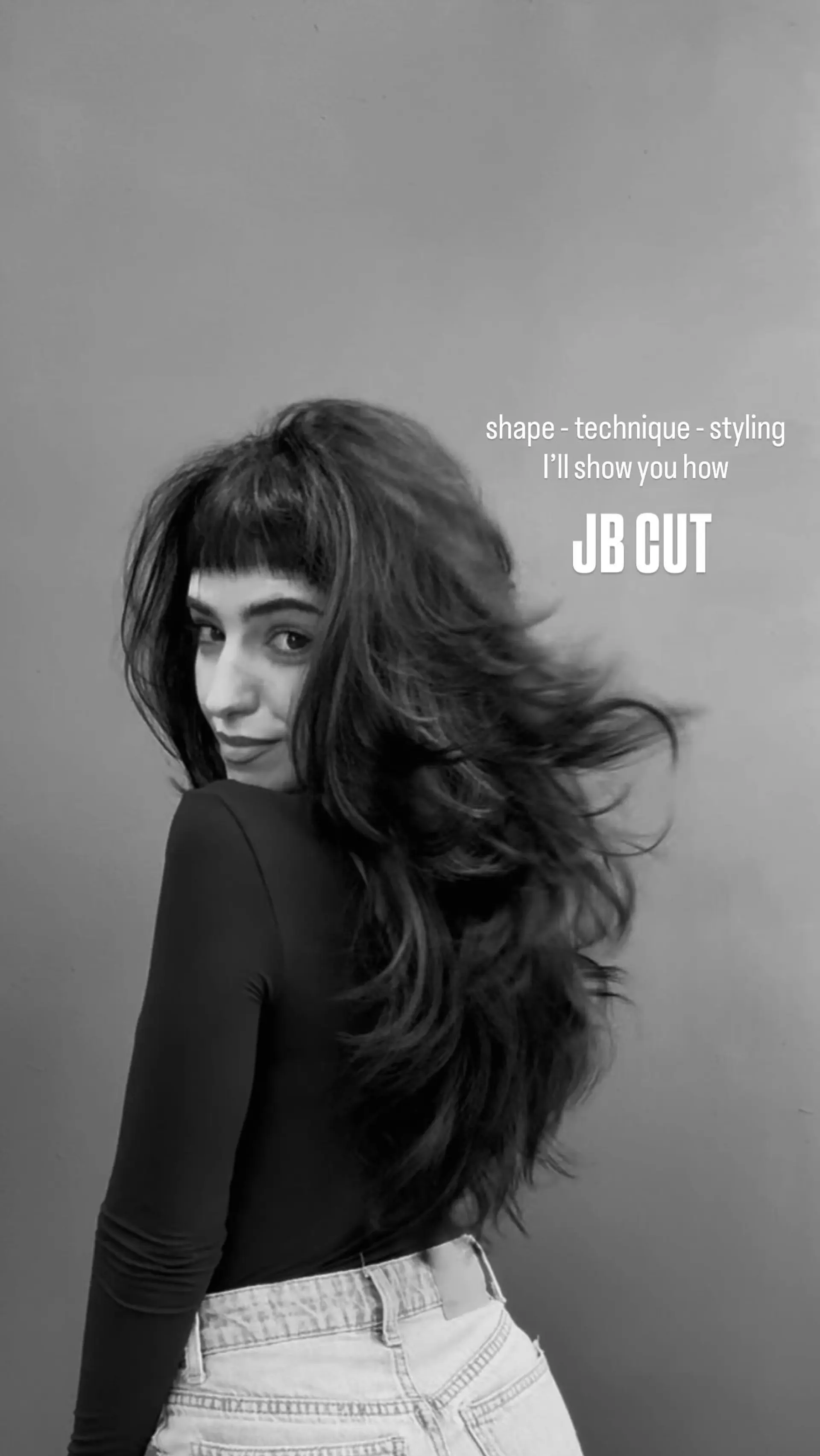 Voluminous long layered haircut featuring airy texture and micro fringe bangs. 1