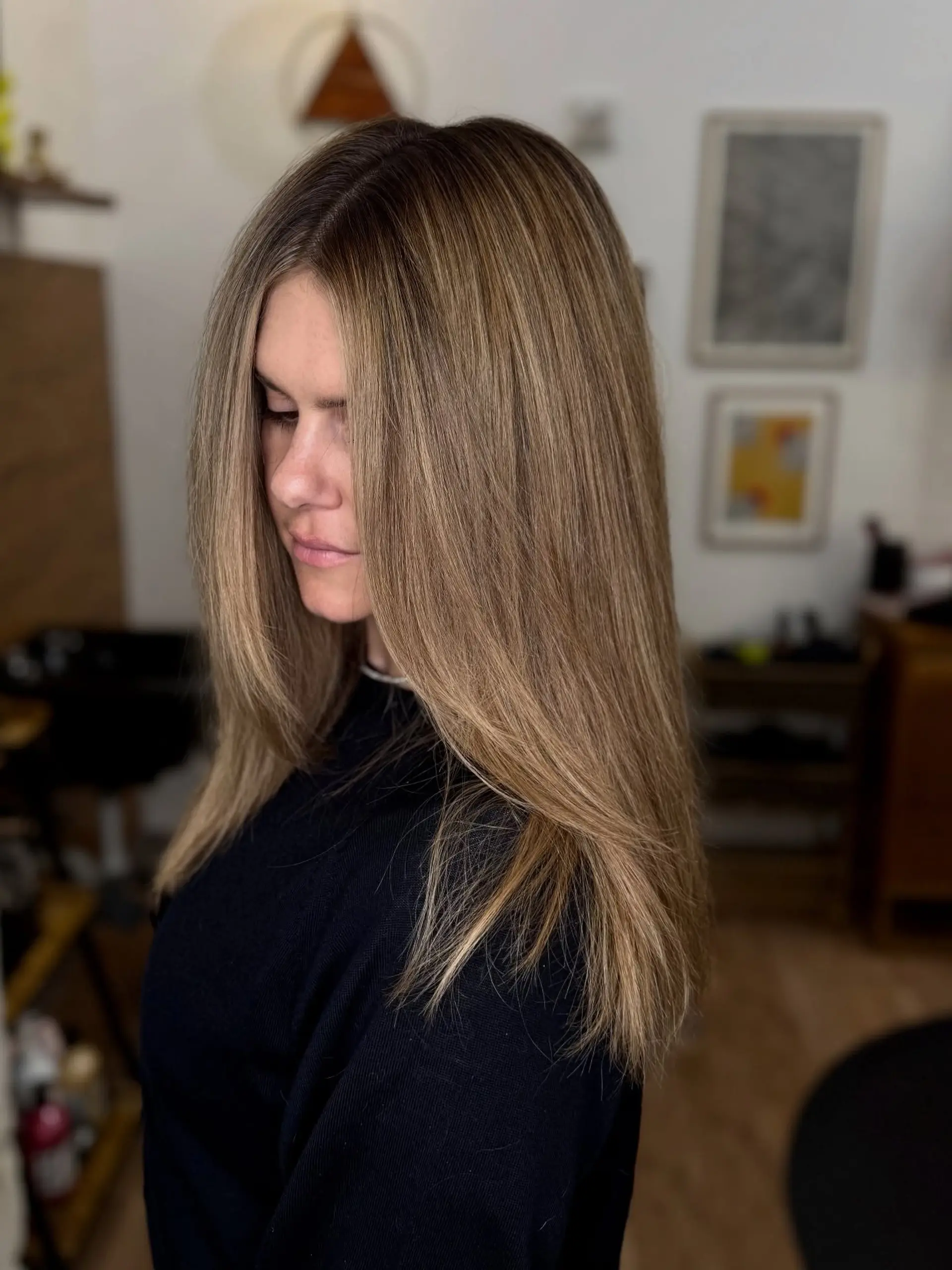 Long straight hair with a seamless root blend and warm honey bronde highlights. 1