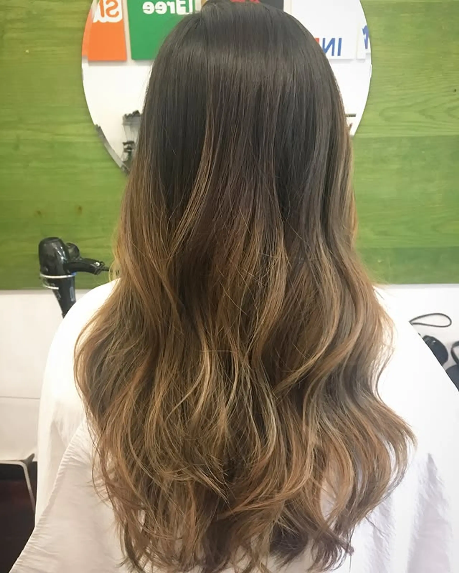 Long wavy hair with bronde balayage color. 1