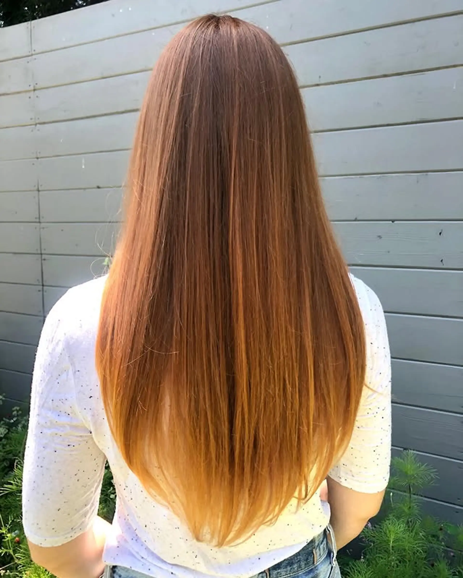 Long, straight hair with a copper to blonde ombre. 1