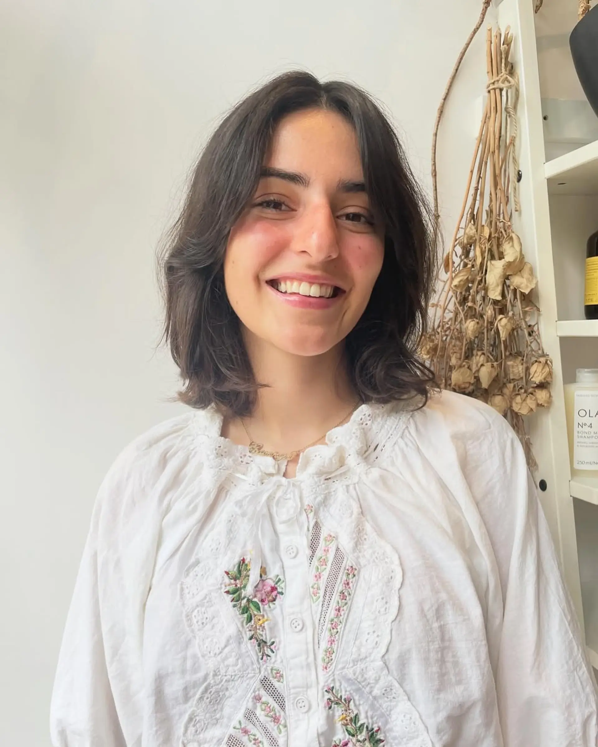 A modern shag haircut featuring curtain bangs and textured layers. 1