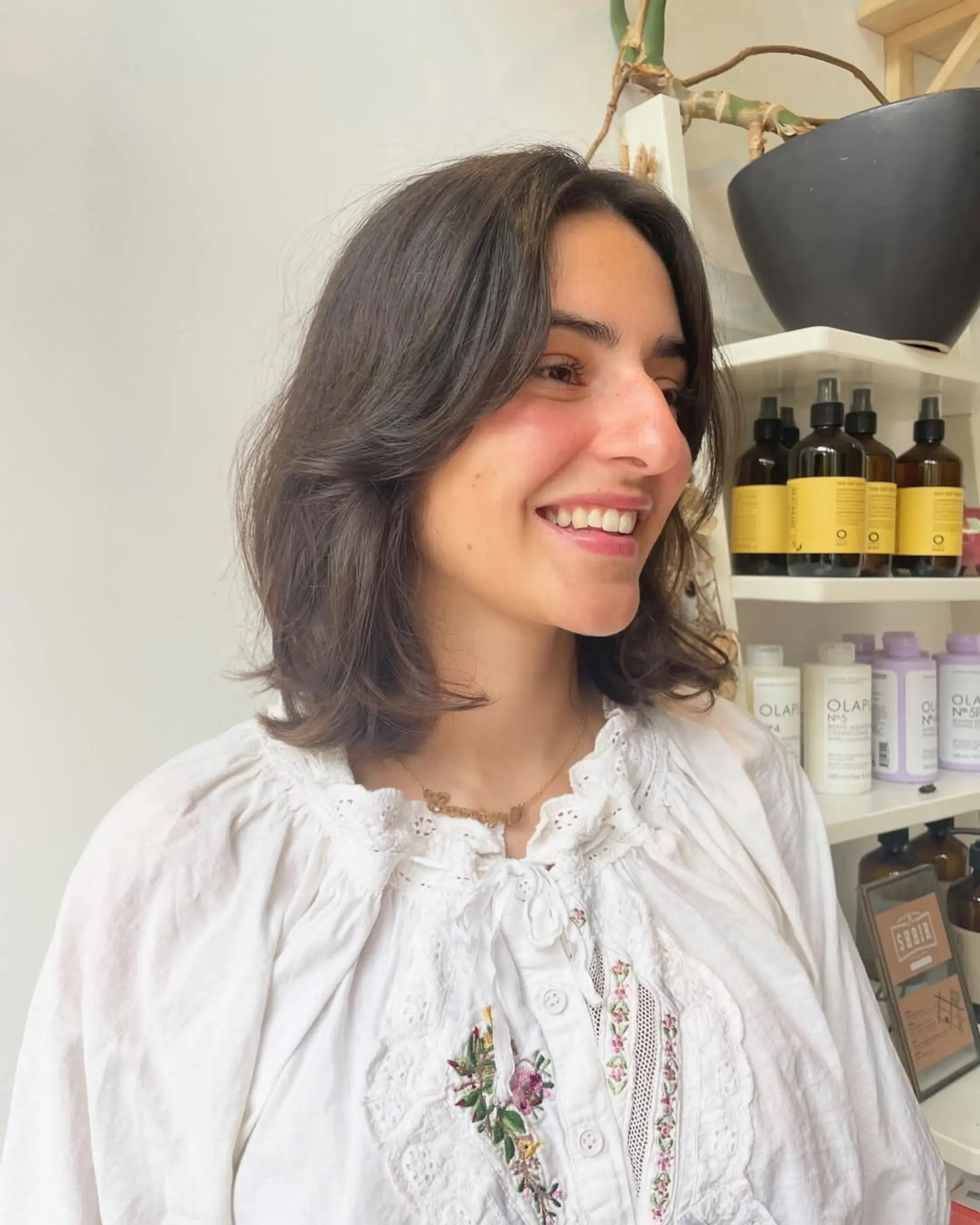 A modern shag haircut featuring curtain bangs and textured layers. 2