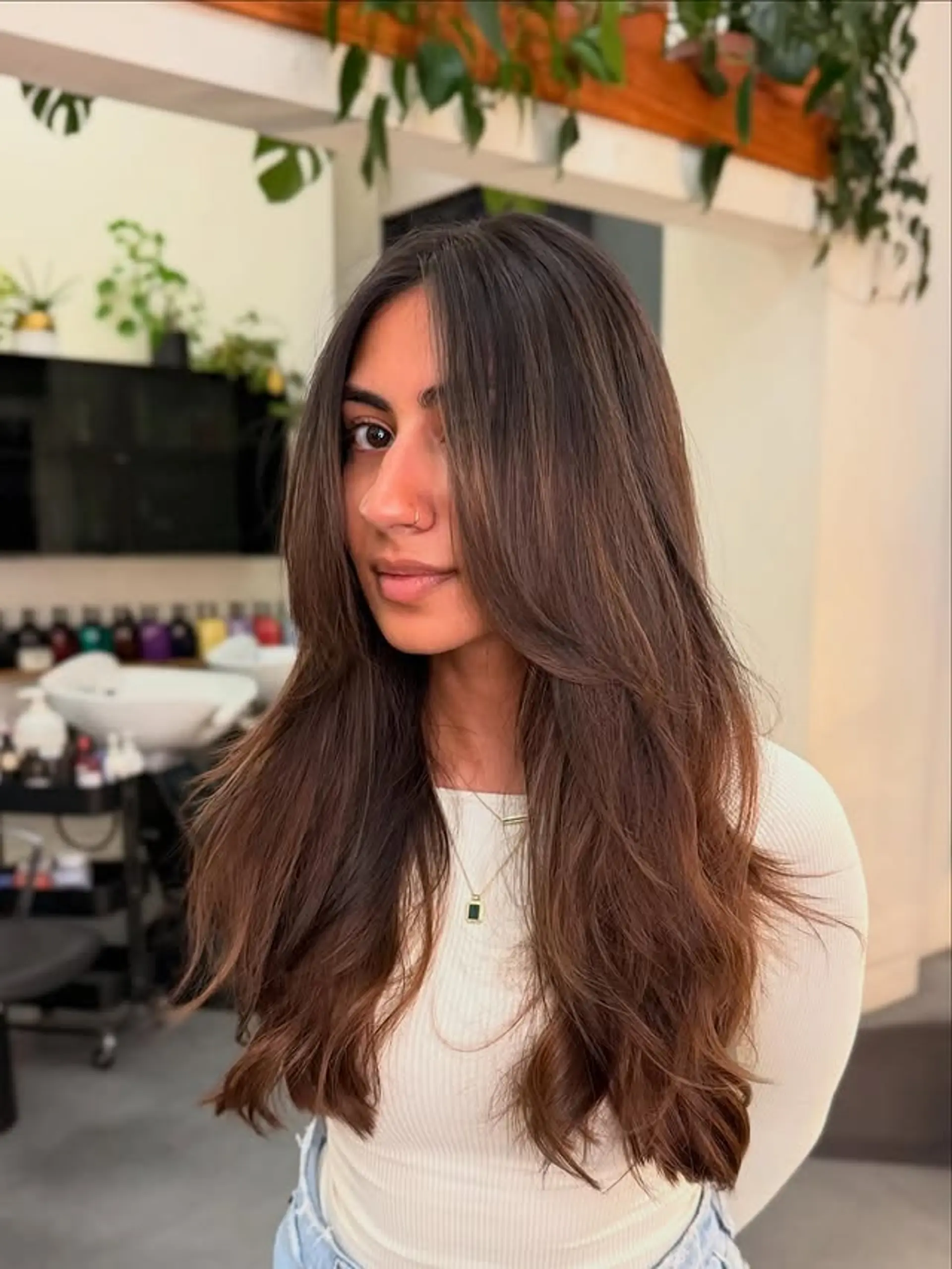 This is a long layered hairstyle with face-framing layers. 1