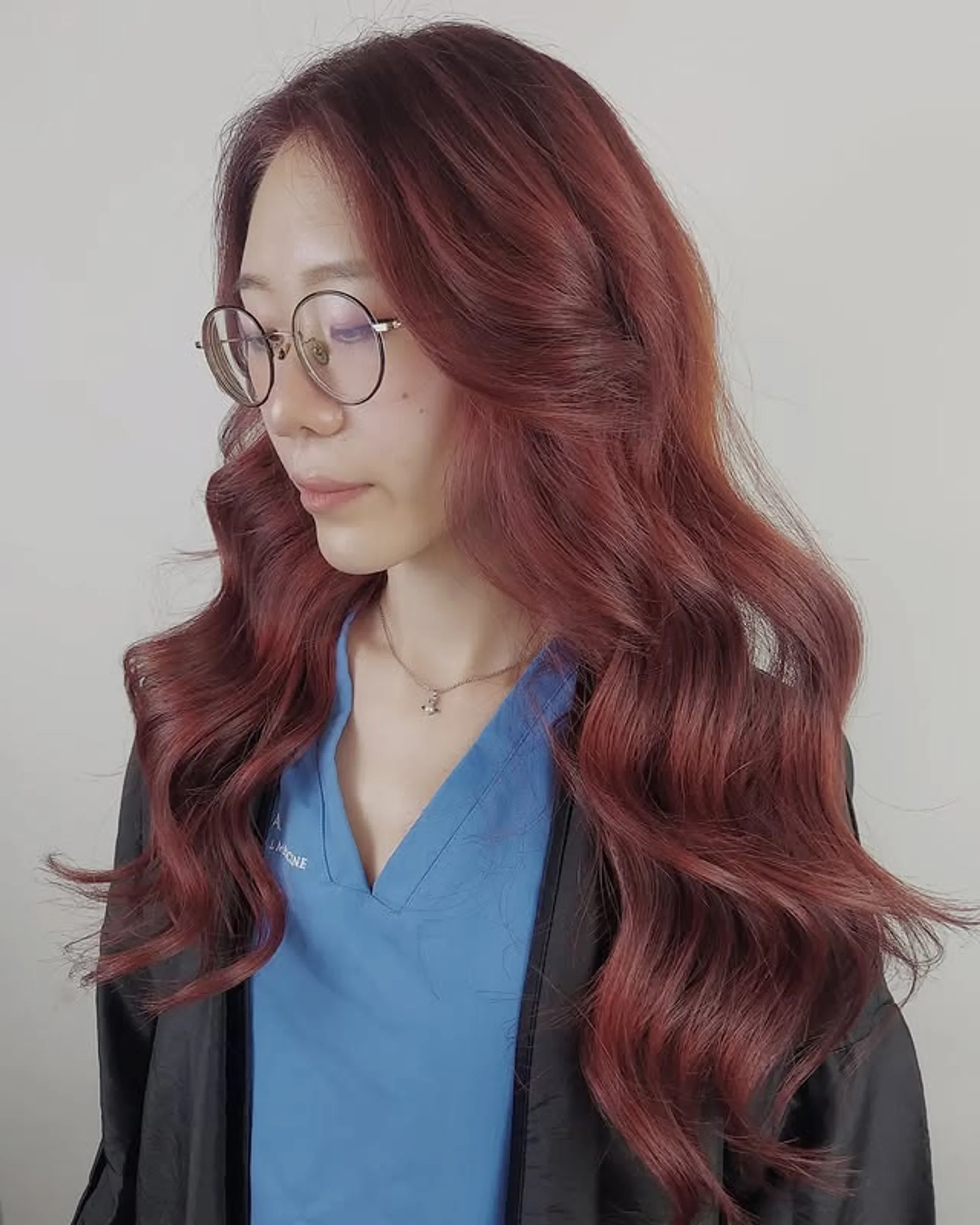 A woman with long, romantic brown waves and face-framing highlights, a key date night hair trend for 2025. - Preview 2