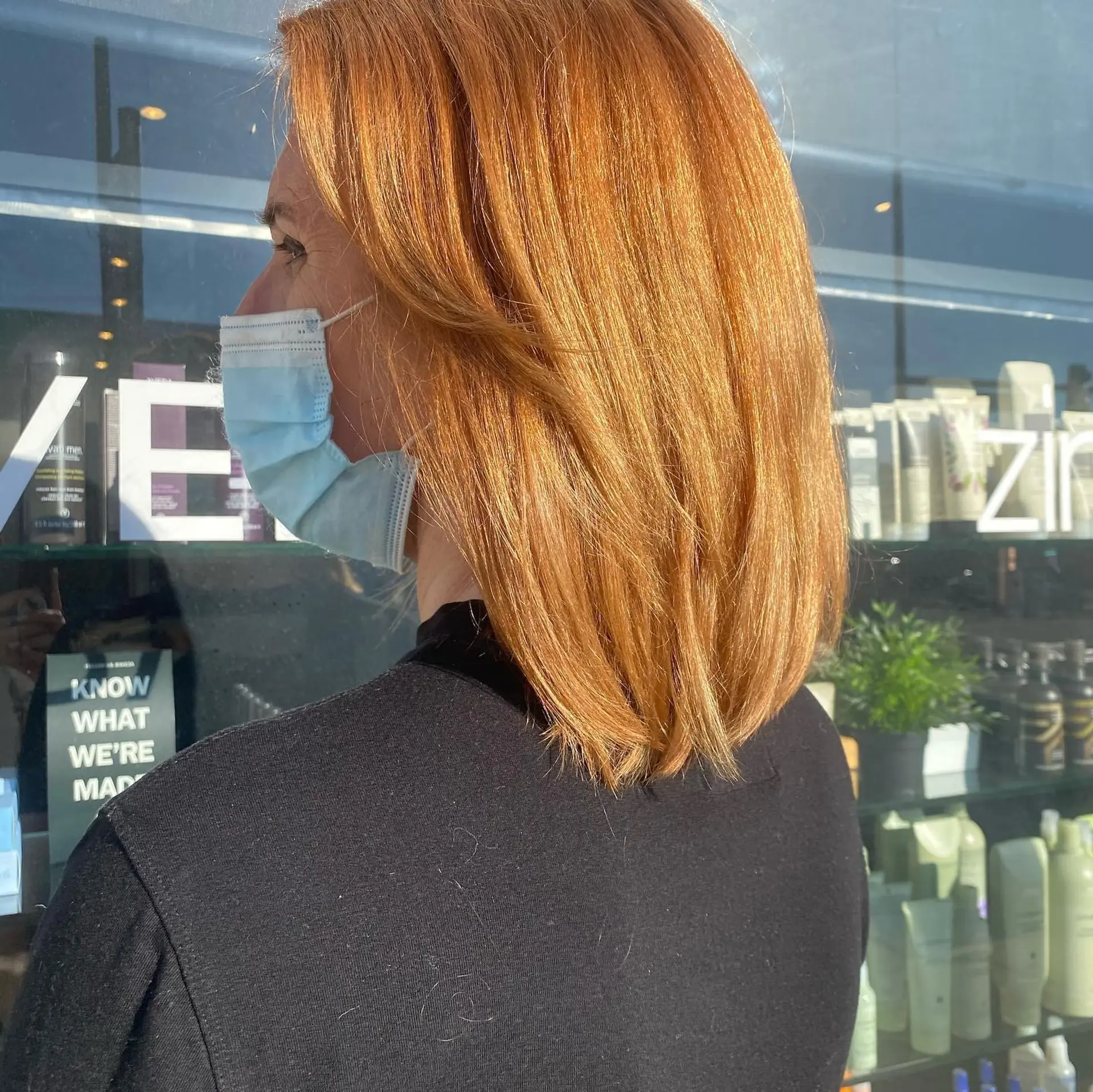 A medium-length straight lob styled in a rich, vibrant ginger copper tone with soft layered ends. 1