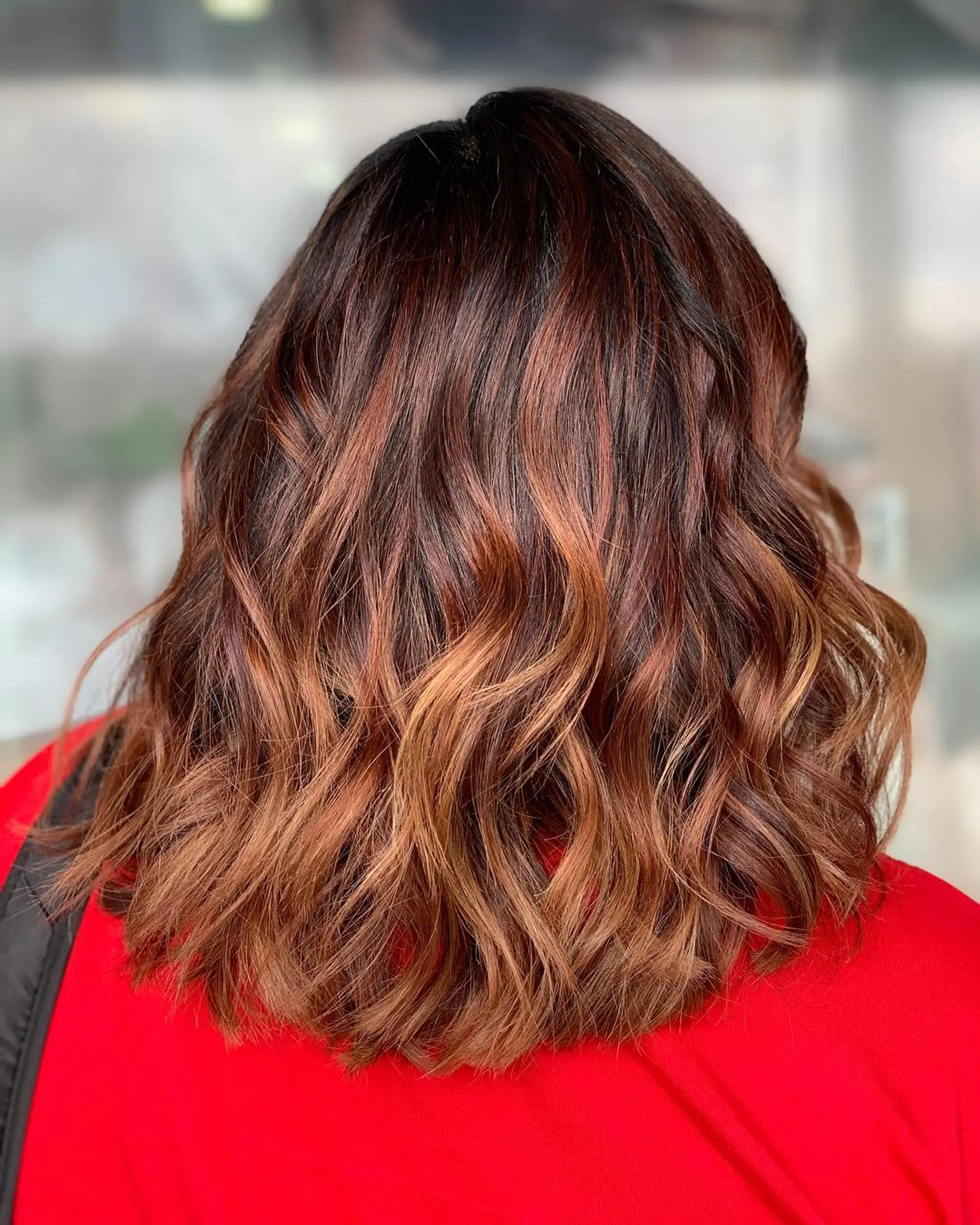 A stylish medium-length wavy lob with a beautiful caramel ombre. 1