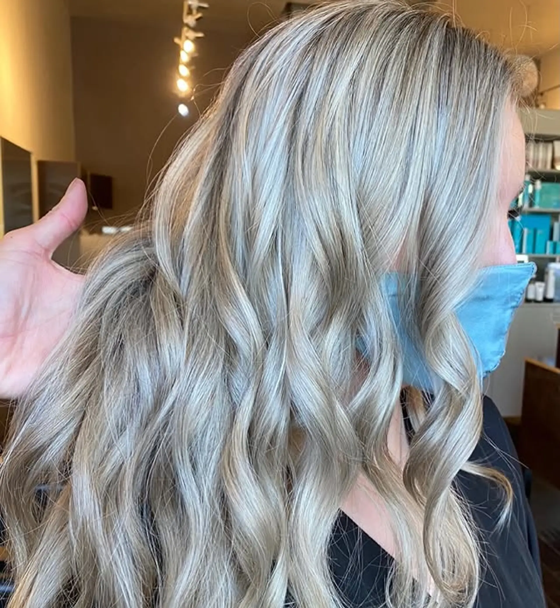 Long wavy hair with an icy blonde balayage. 1