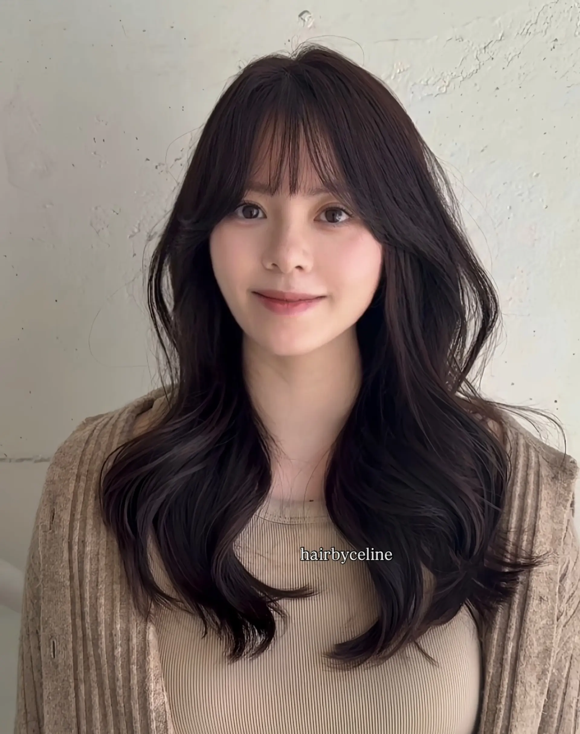 Long, black wavy hair with wispy, see-through bangs. 1