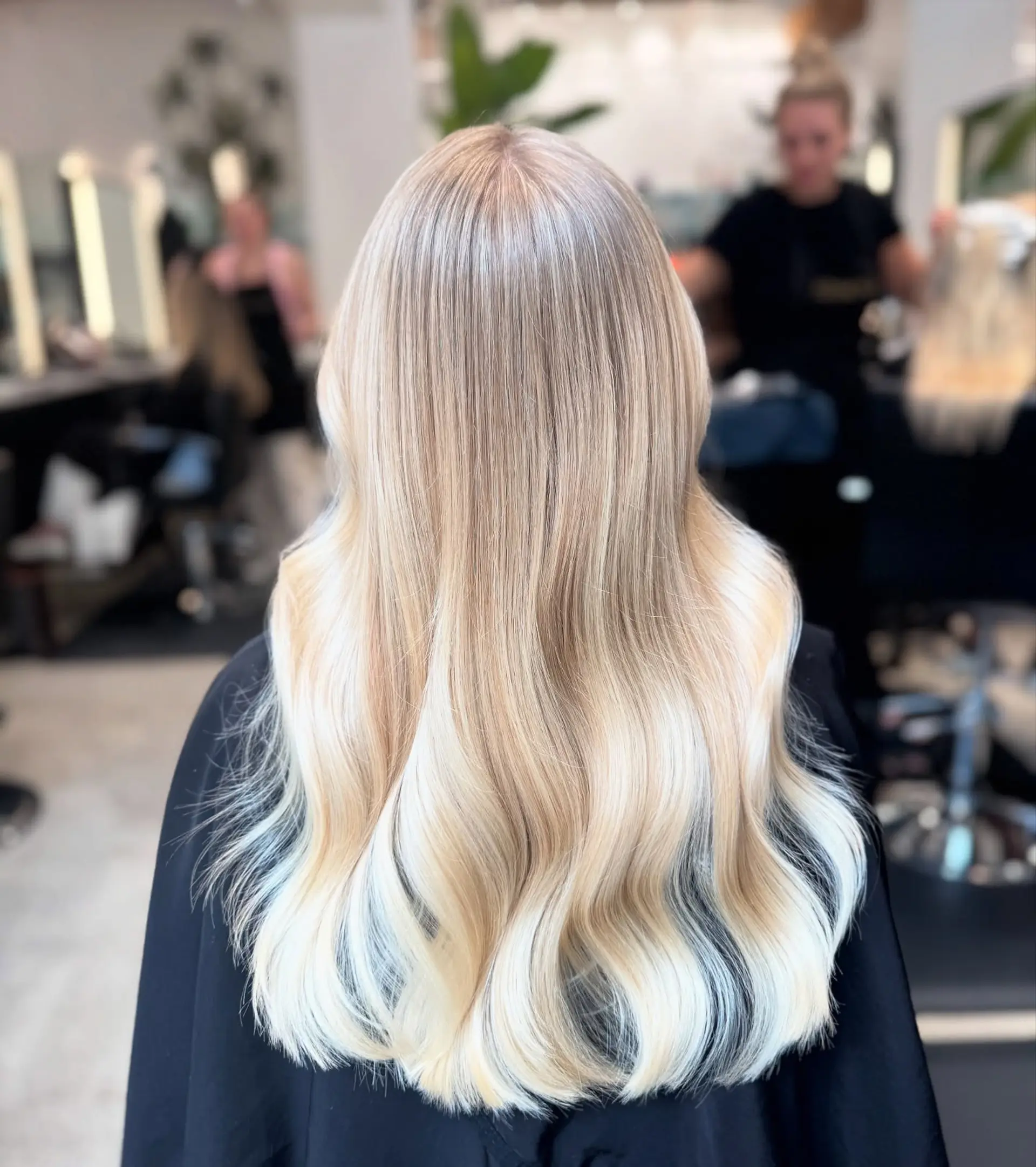 Long, wavy hair with a buttery blonde balayage. 1