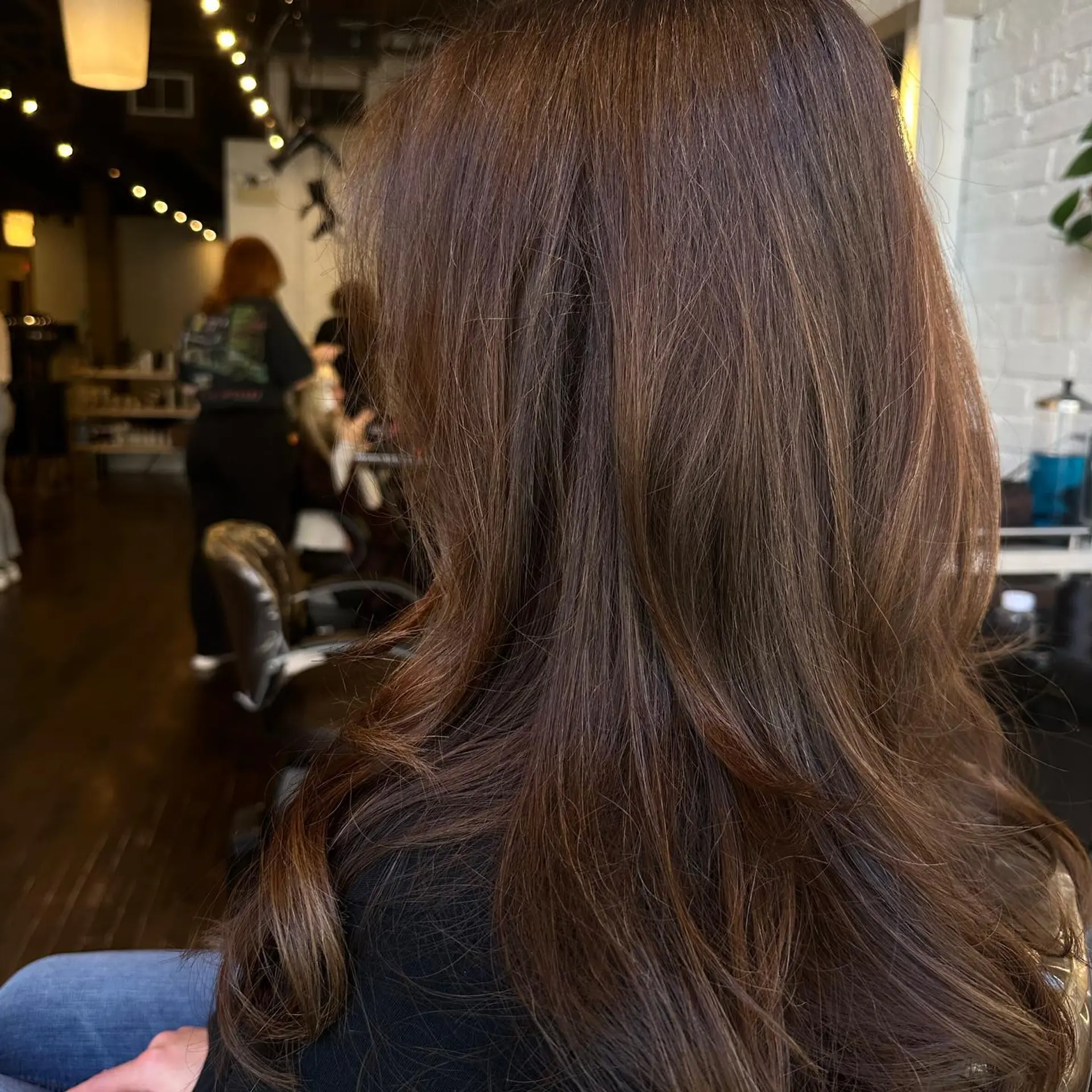 Long layered hairstyle with subtle balayage highlights. 1