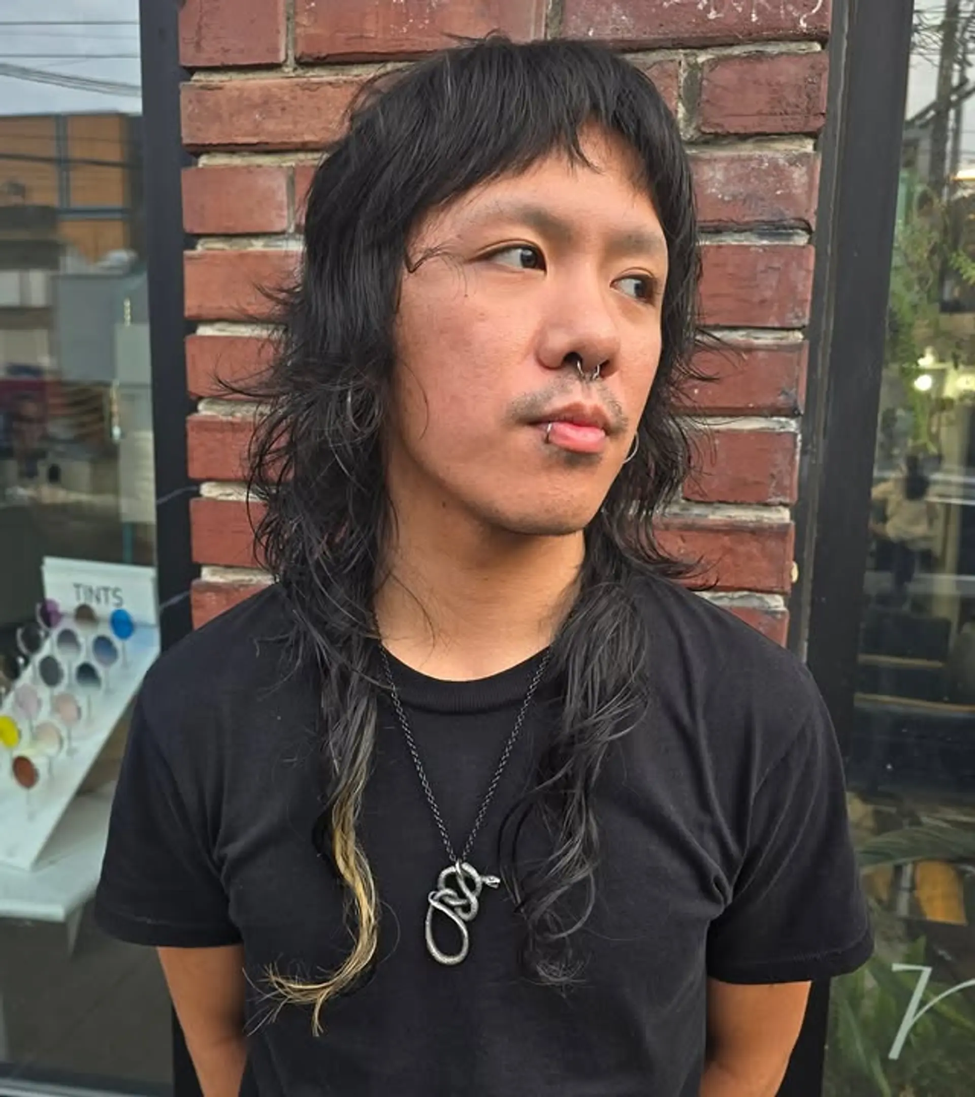 A modern take on the classic mullet featuring shaggy layers and a slightly tousled texture for an edgy look. 1