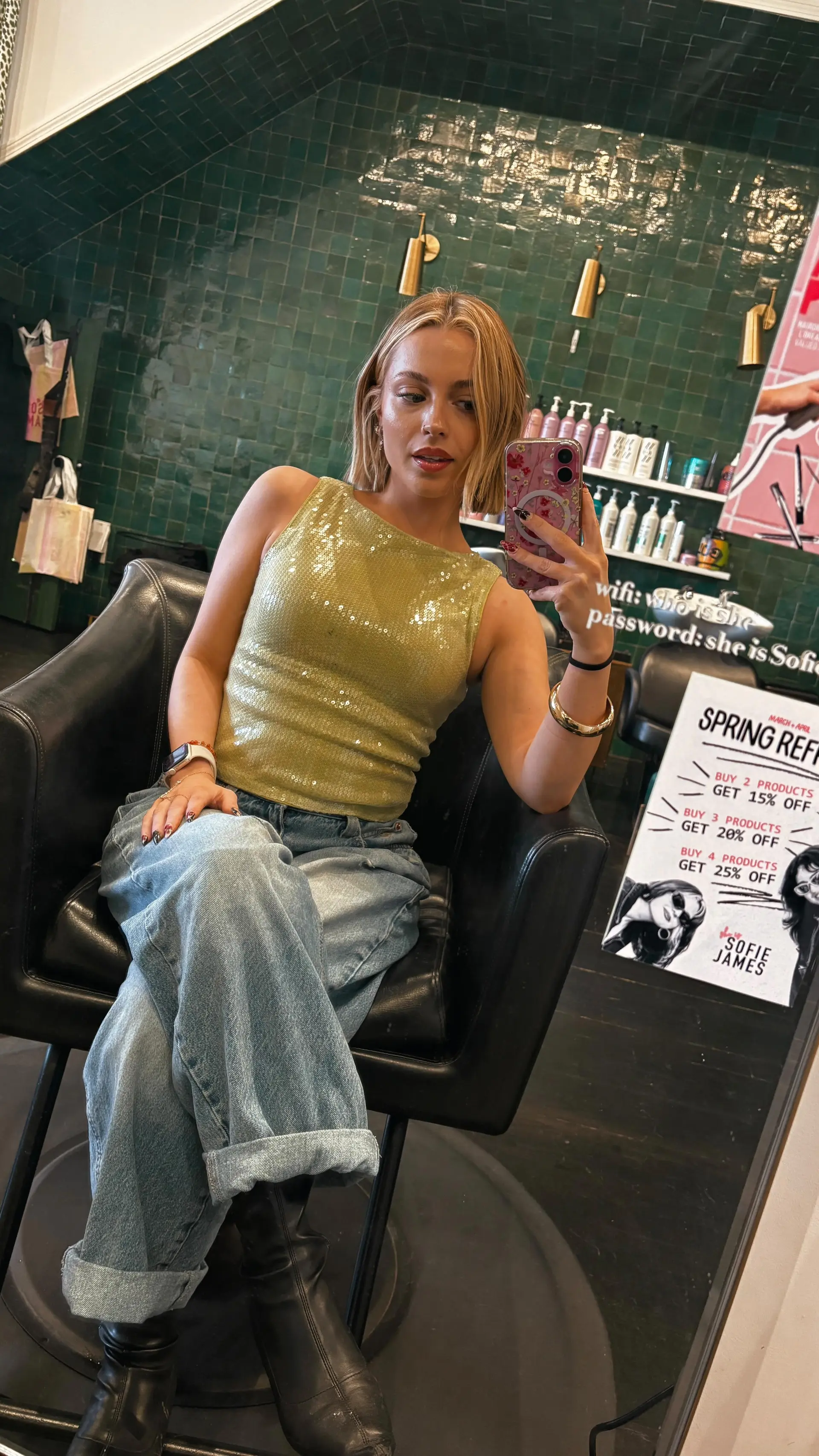 A textured chin-length bob cut styled with a center part and soft, lived-in bend for effortless volume. 1