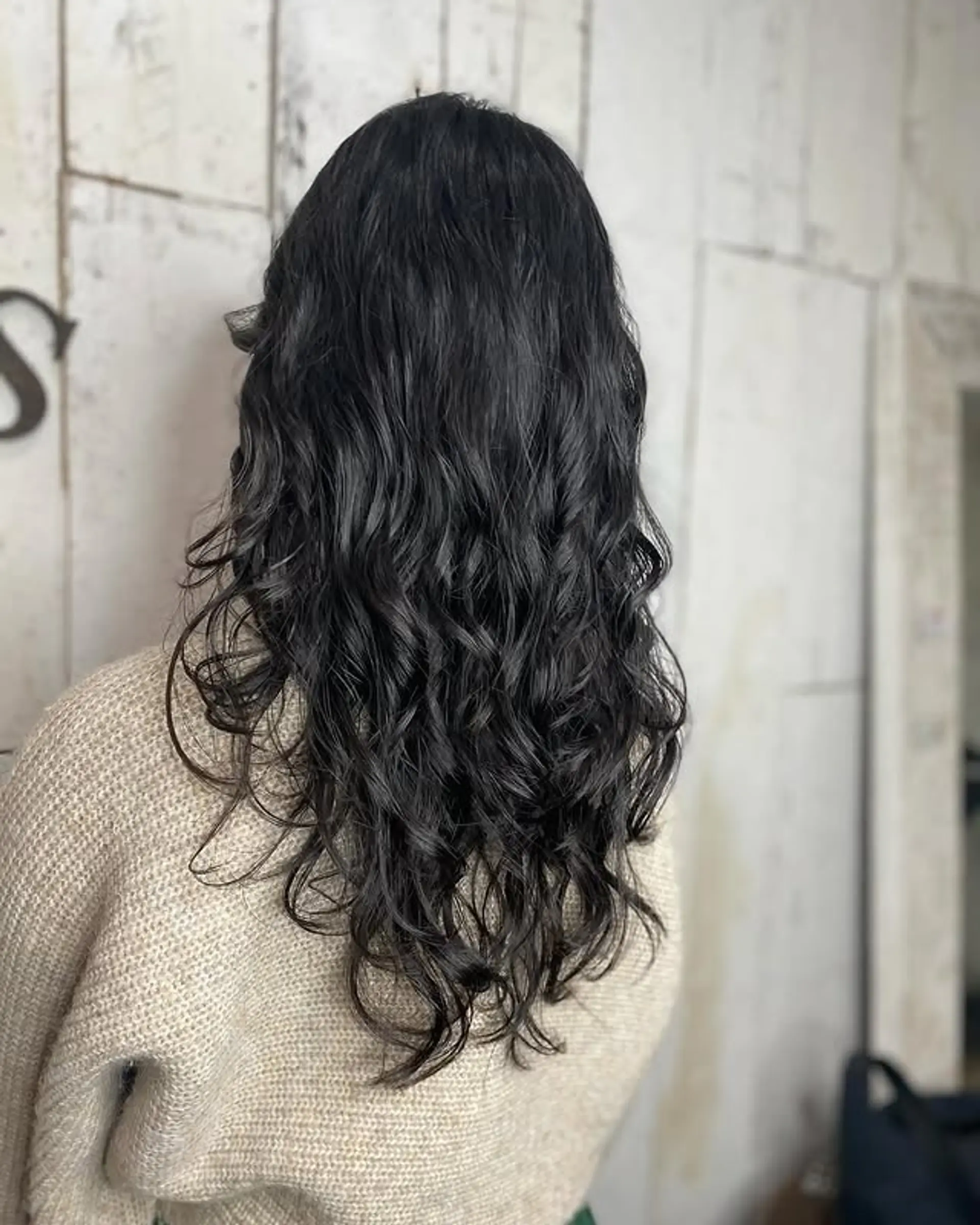 Long layered haircut that enhances natural waves. 1