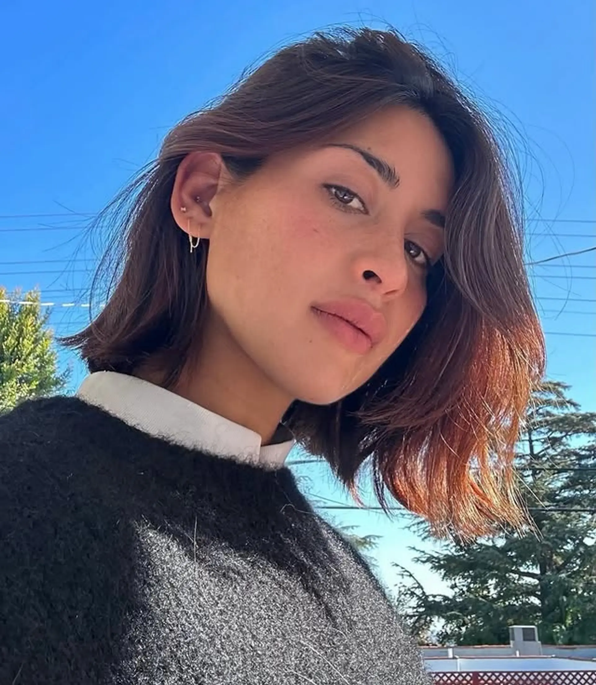 A modern layered bob haircut that frames the face beautifully. 1