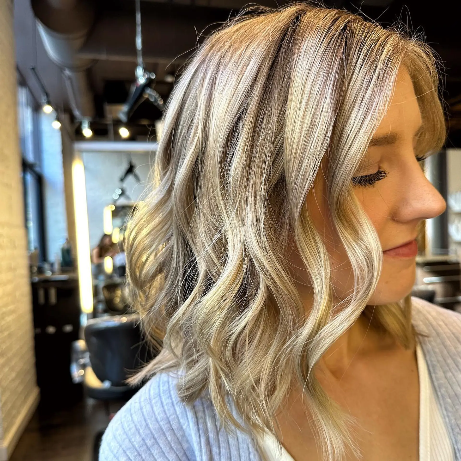 A wavy lob with balayage highlights and beachy waves. 1