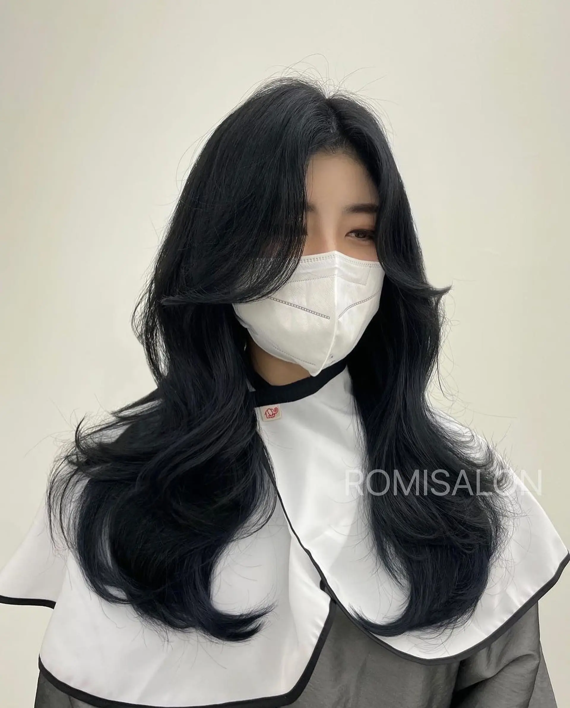 Flowy layered hairstyle with soft waves and face-framing layers. 1