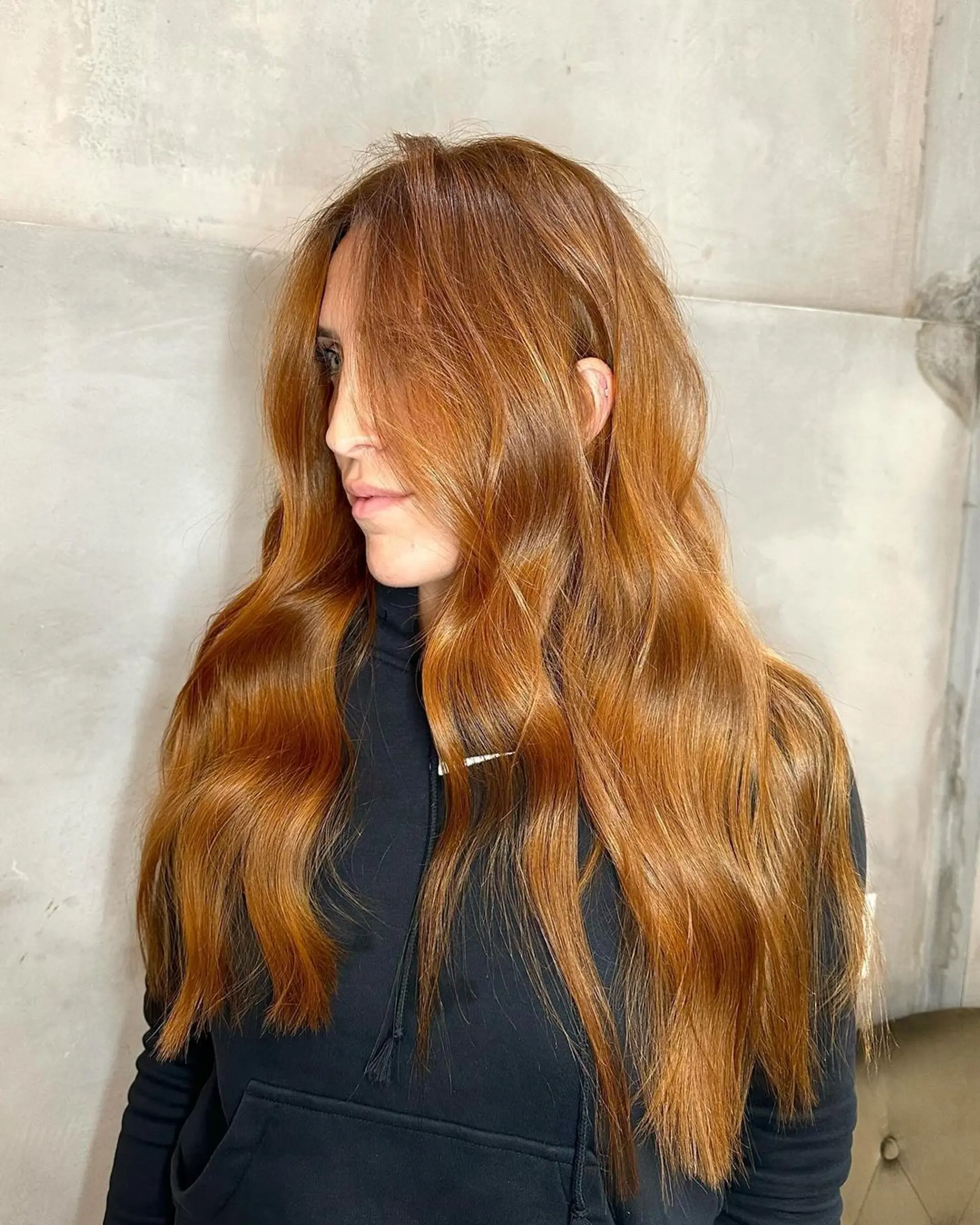 Very long, wavy, and glossy hair with a blend of copper and golden blonde hues, featuring natural layers that promote a flowing, radiant look. 2