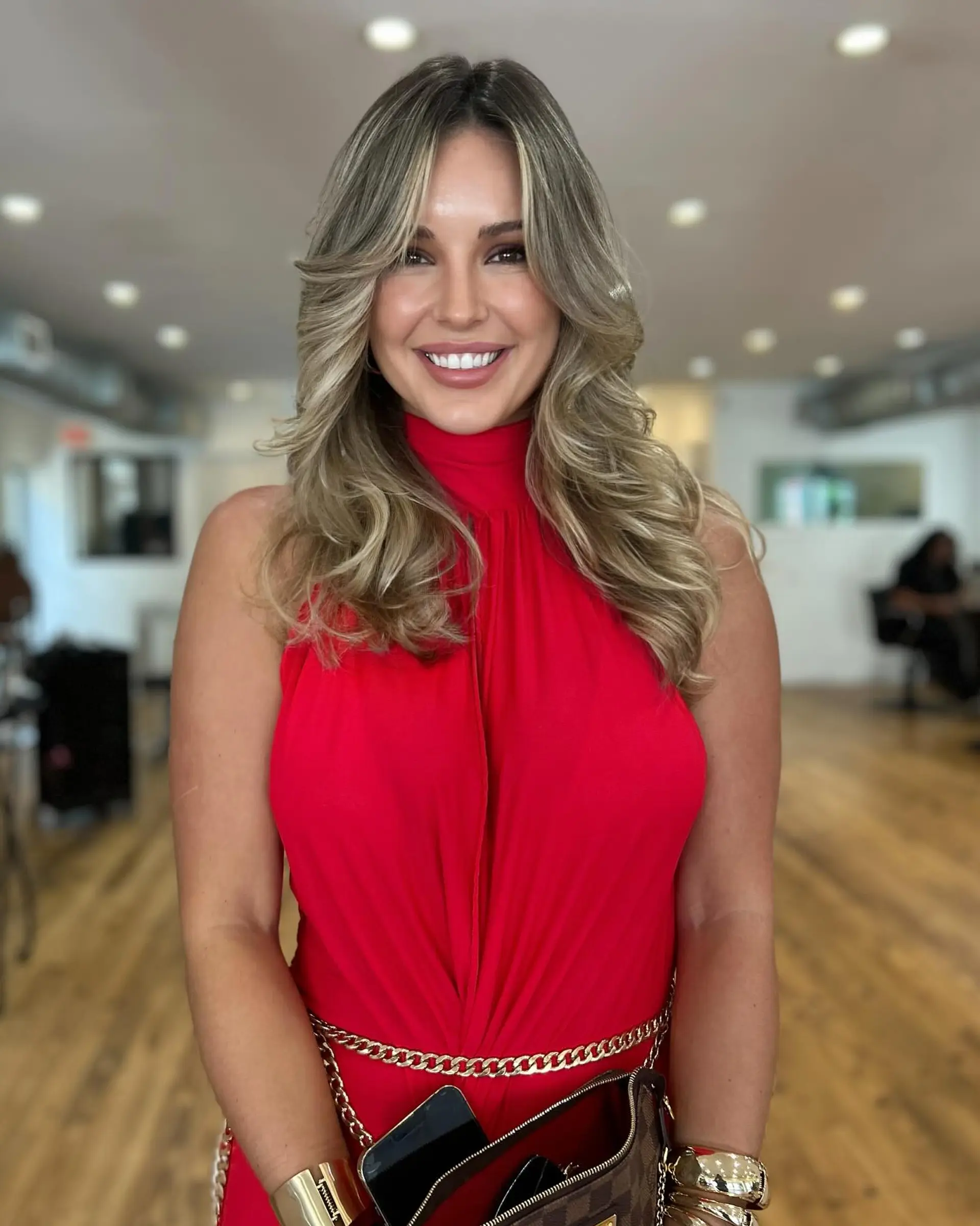 Long, layered hairstyle with a soft, wavy texture and face framing layers. 1