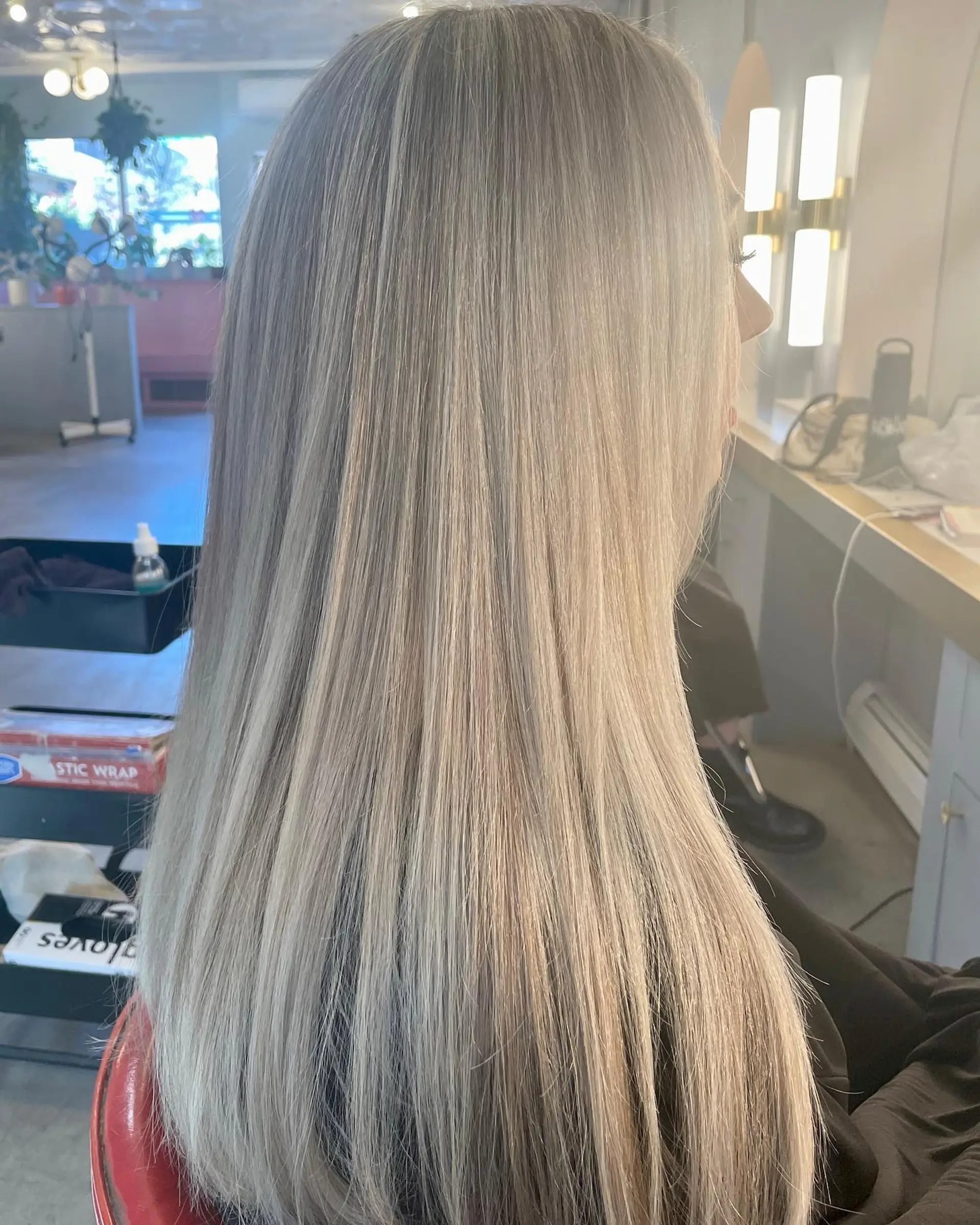 Long, straight icy platinum blonde hair with a clean, healthy look. 1