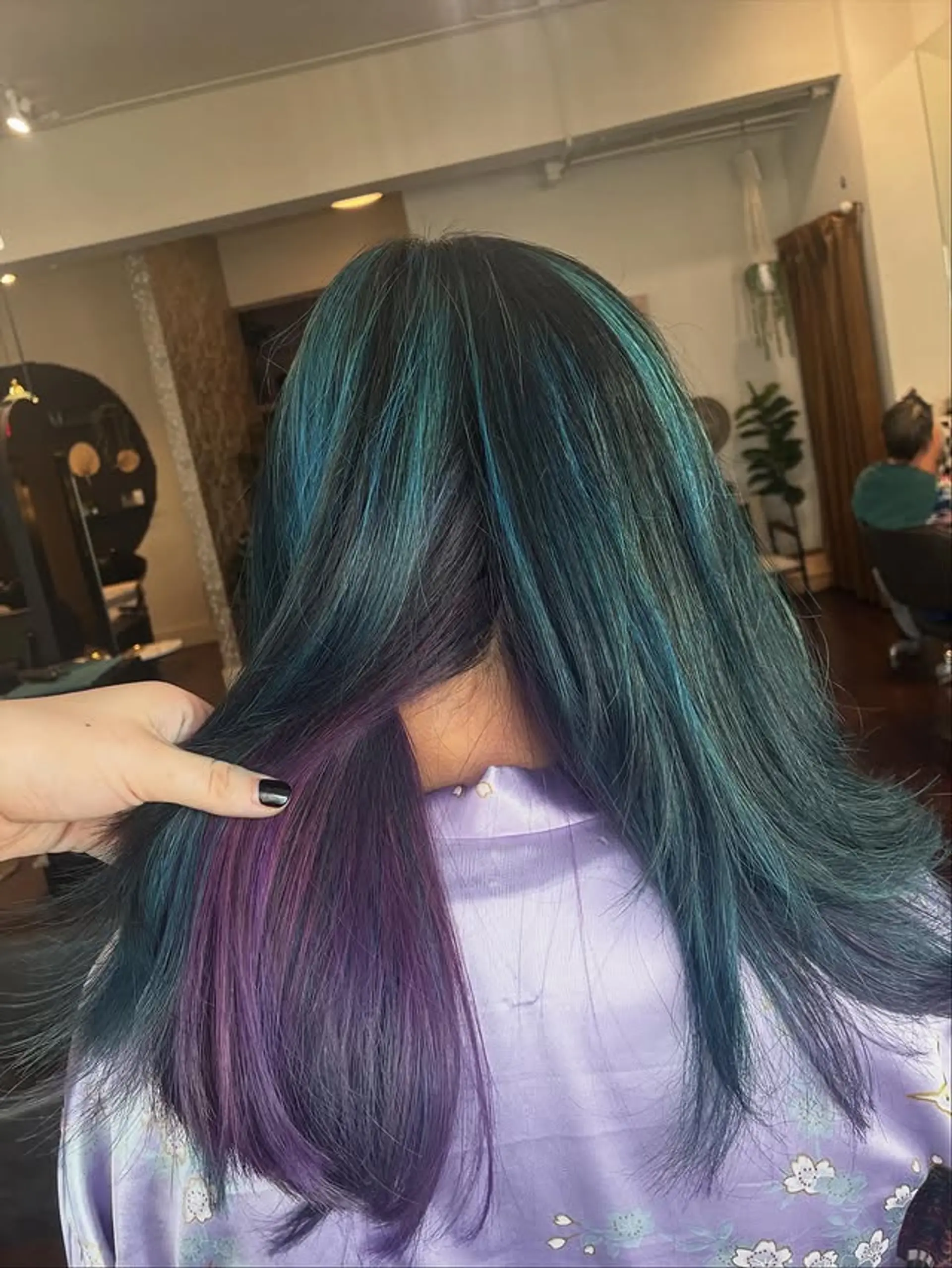 Long, straight hair with a black to teal ombre and a hidden section of amethyst purple. 1