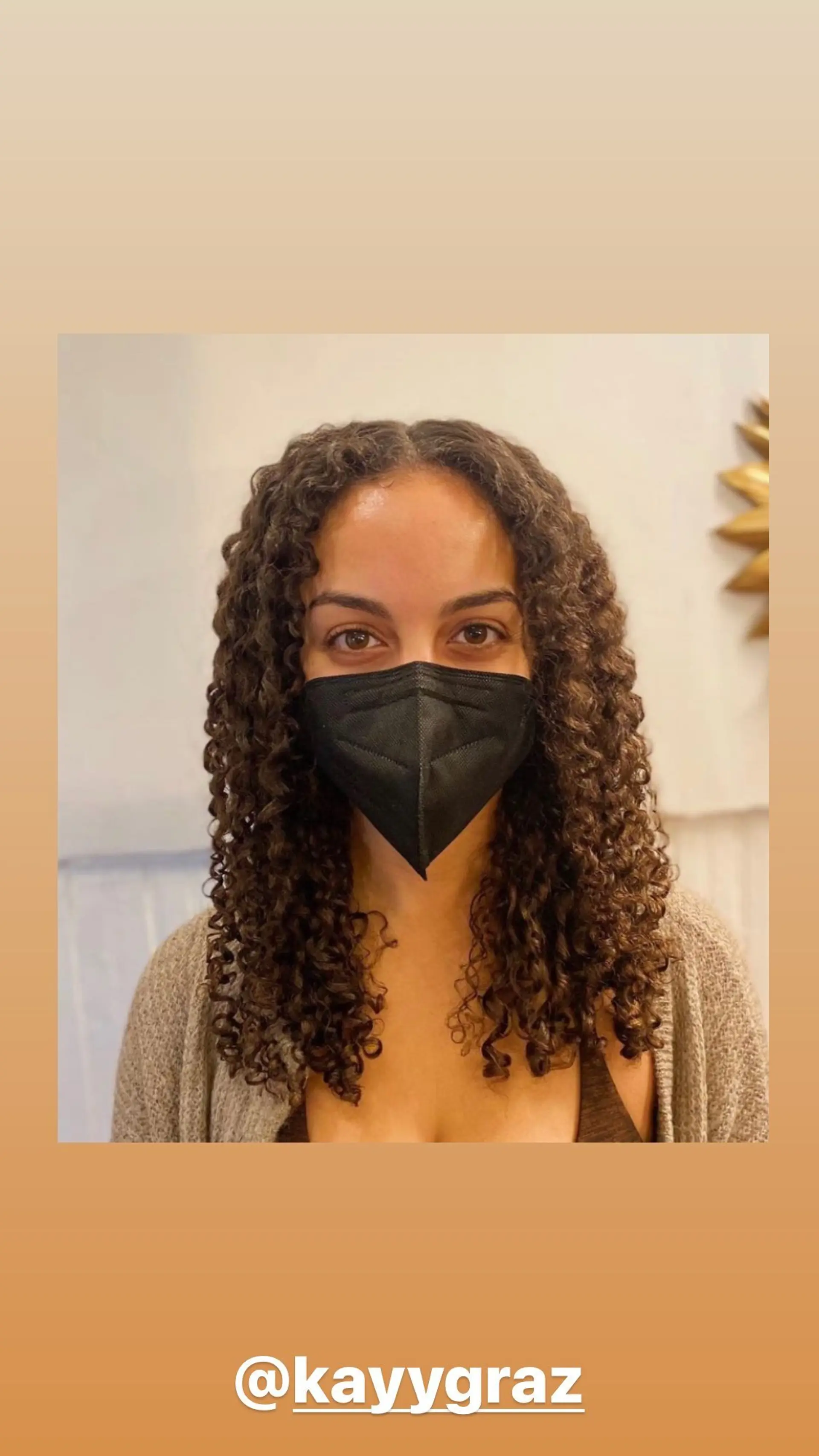 A classic medium-length curly hairstyle with defined, natural curls. 1