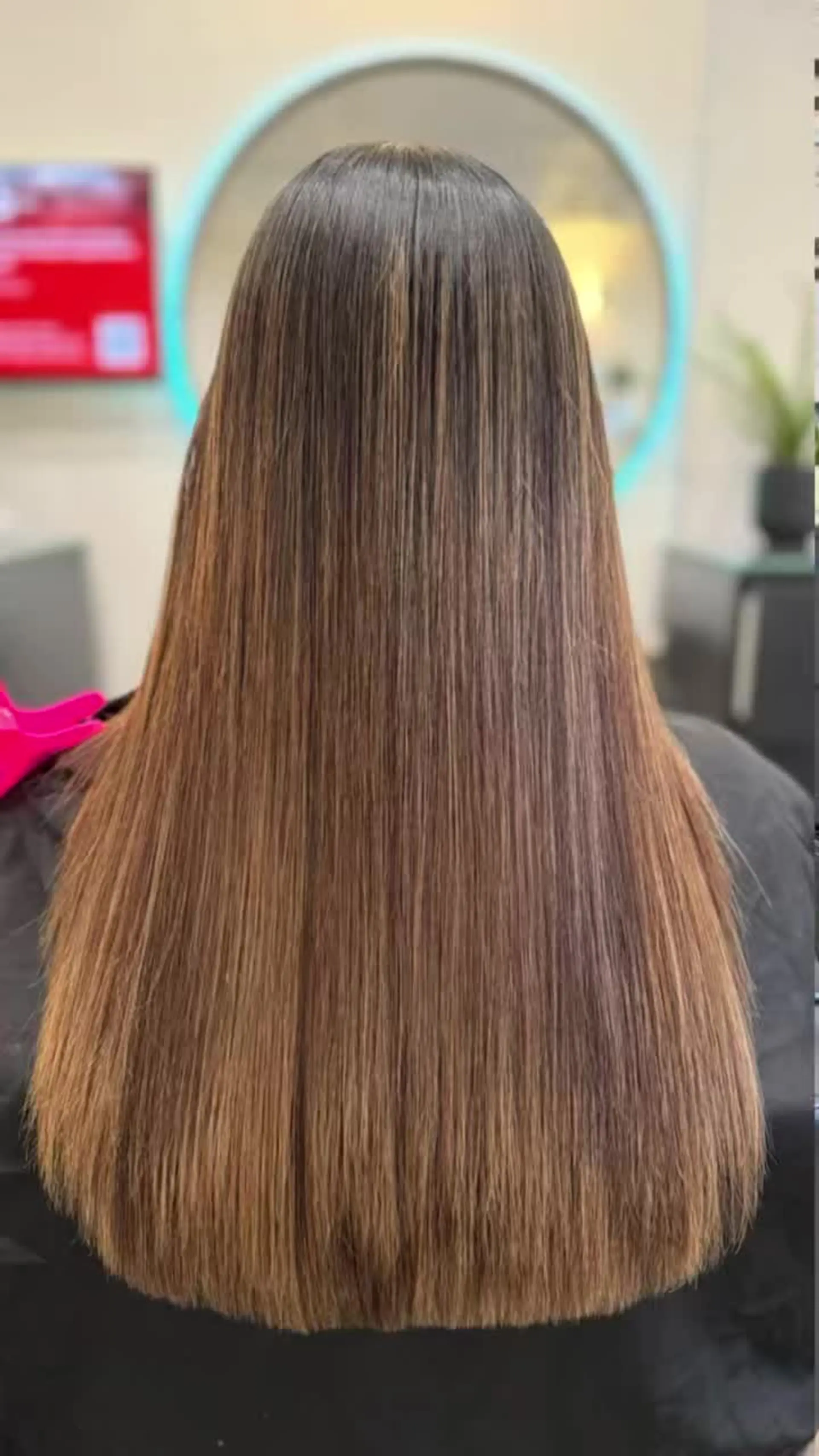 Long, ultra-smooth straight hair with a glossy, frizz-free finish and soft brown dimensional tones. 1