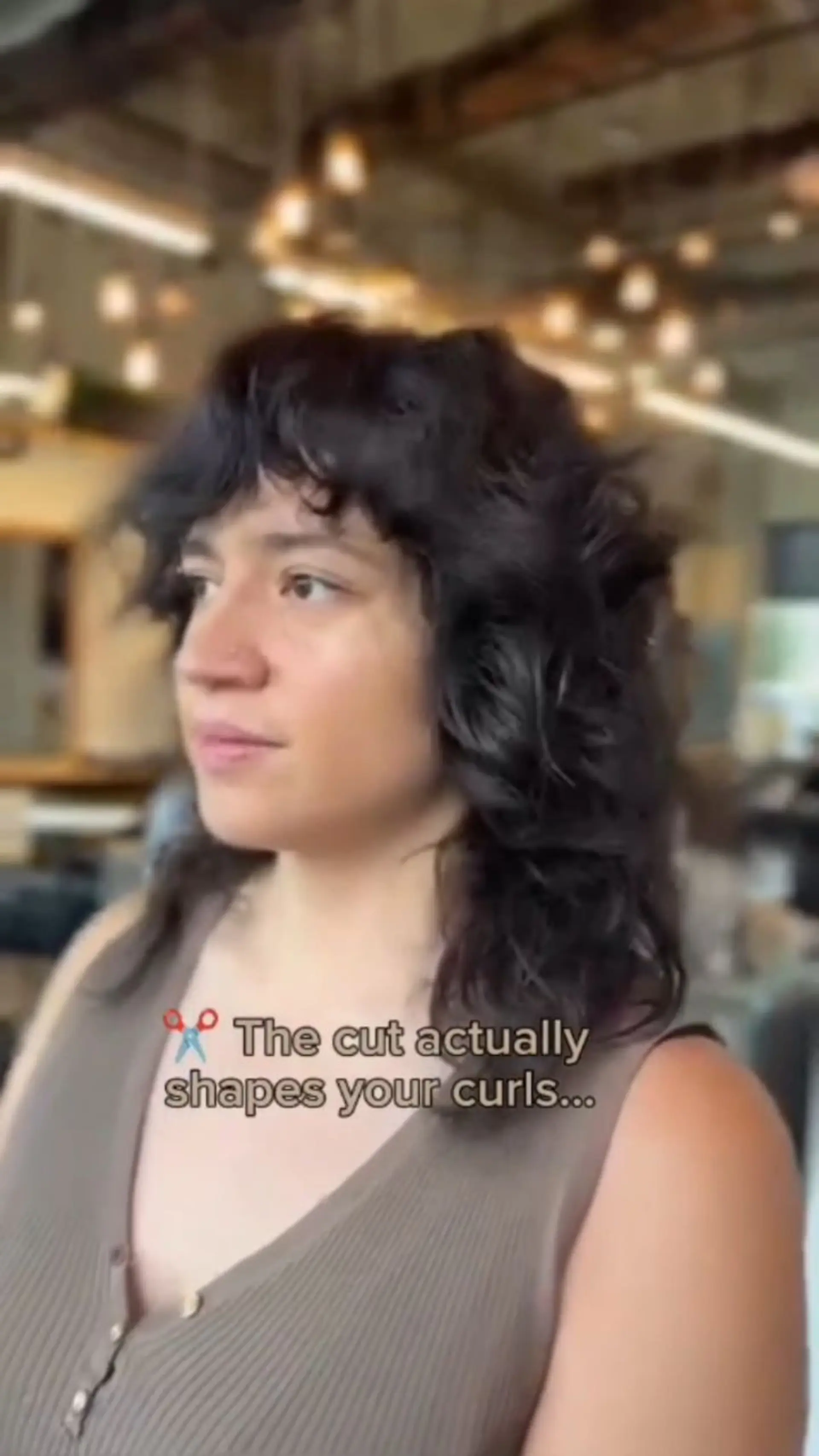 A medium-length curly shag featuring layered texture, face-framing fringe, and natural volume. 1