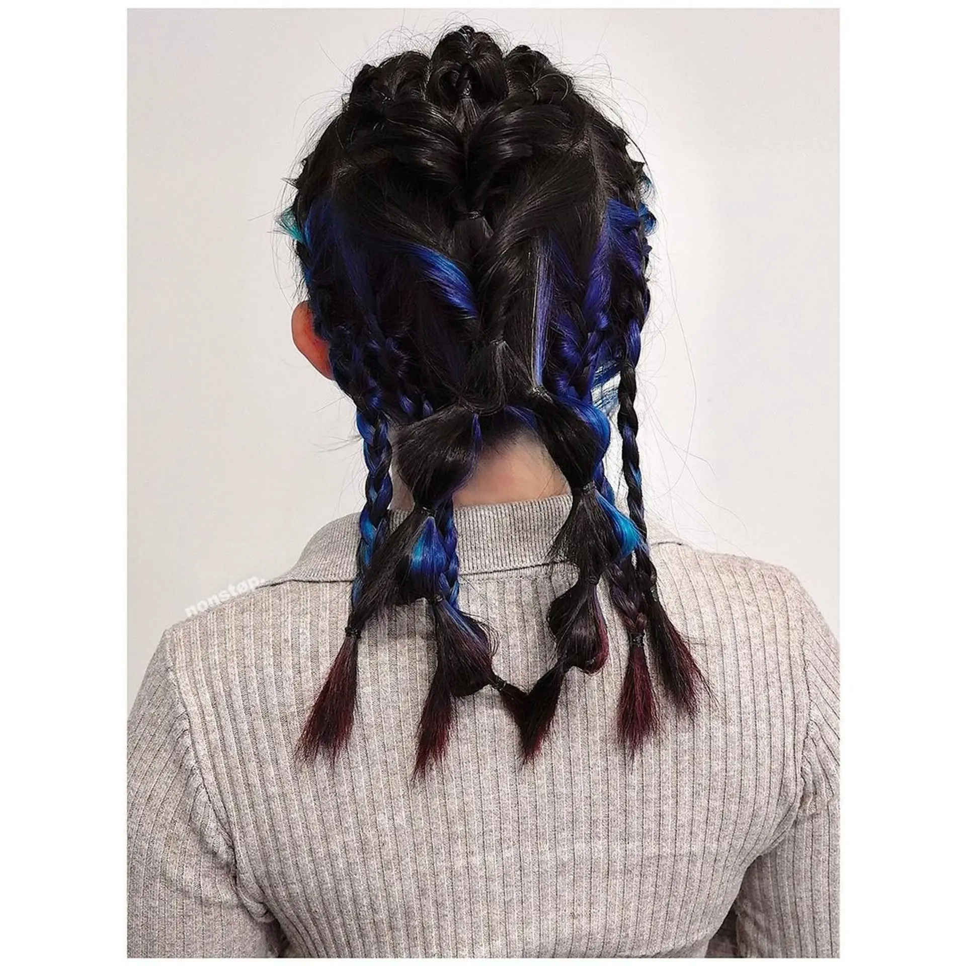 A bold undercut on one side with braided sections in black, blue, and purple intertwining. Loose ends of the braids are twisted for added dimension, while the hair on the other side is left down and smooth.

Hair color by VINCENT🌌Hairbrained by YUKI 2