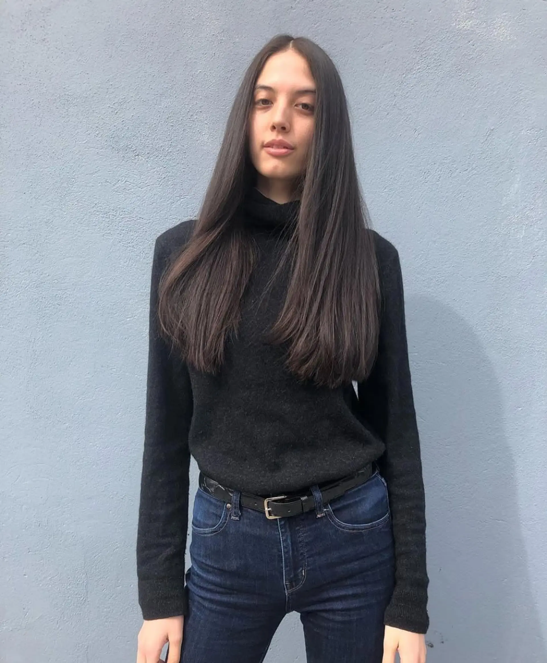 Long, straight dark brown hair with a center part and minimal layers, featuring a smooth and sleek finish. 1