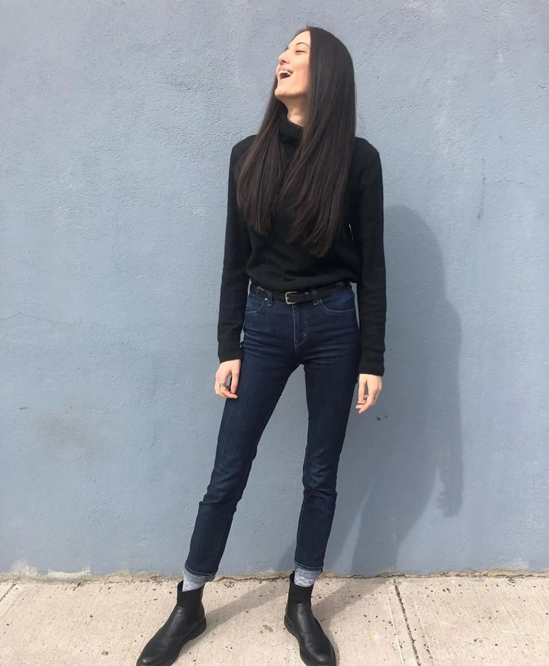 Long, straight dark brown hair with a center part and minimal layers, featuring a smooth and sleek finish. 2