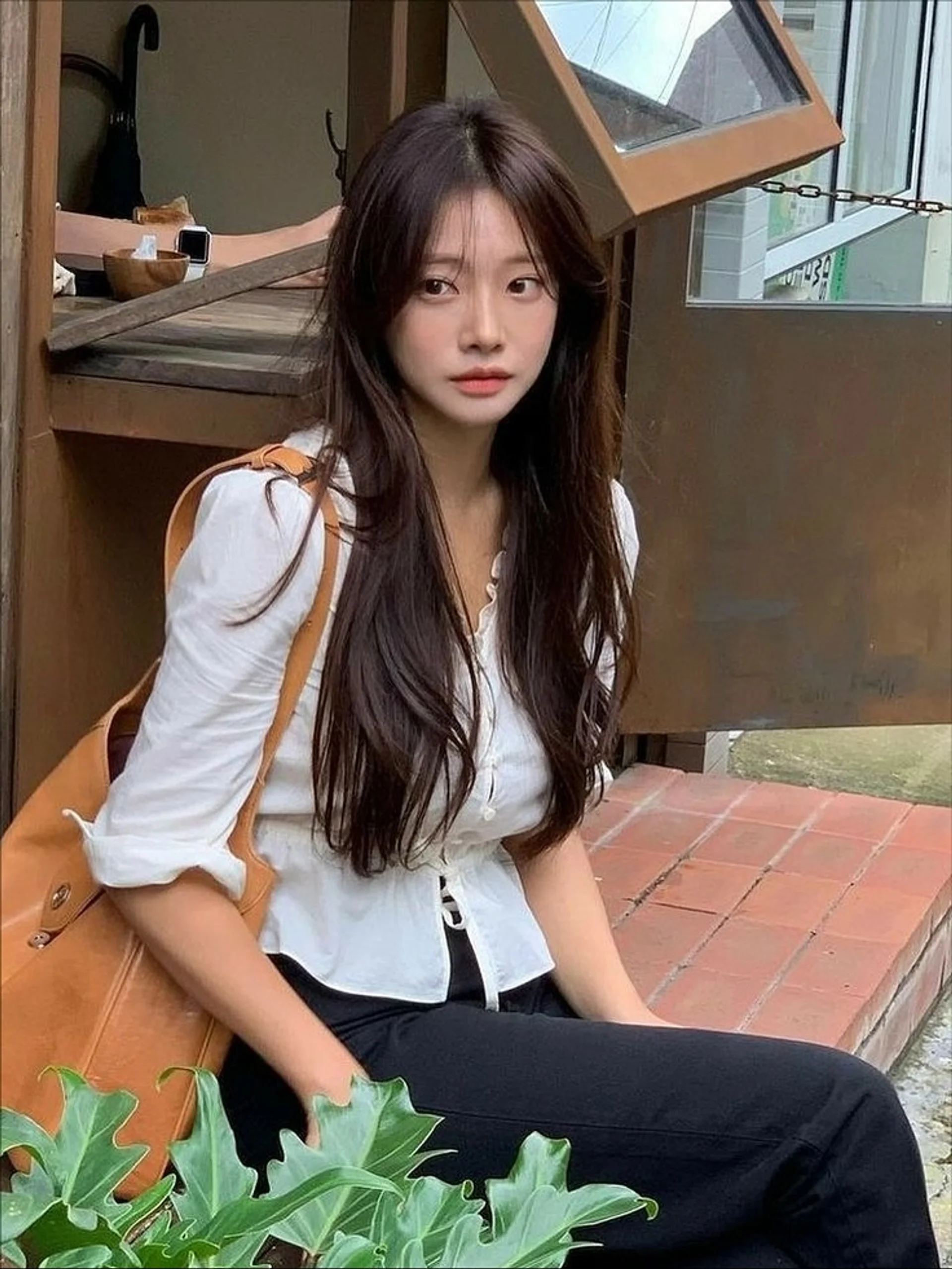 Creamy blonde long wavy hair with wispy bangs framing the face, a popular 2025 trend. - Preview 3