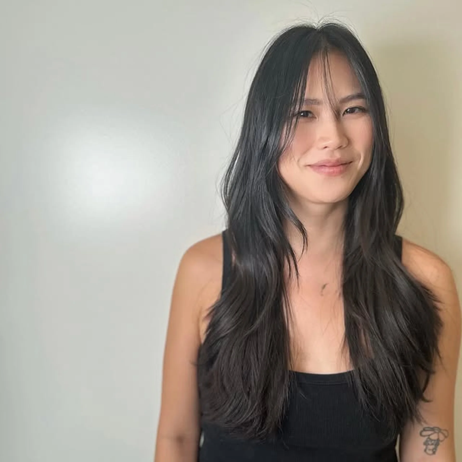 A long, straight brunette hairstyle with distinct face-framing layers that add dimension. - Preview 1