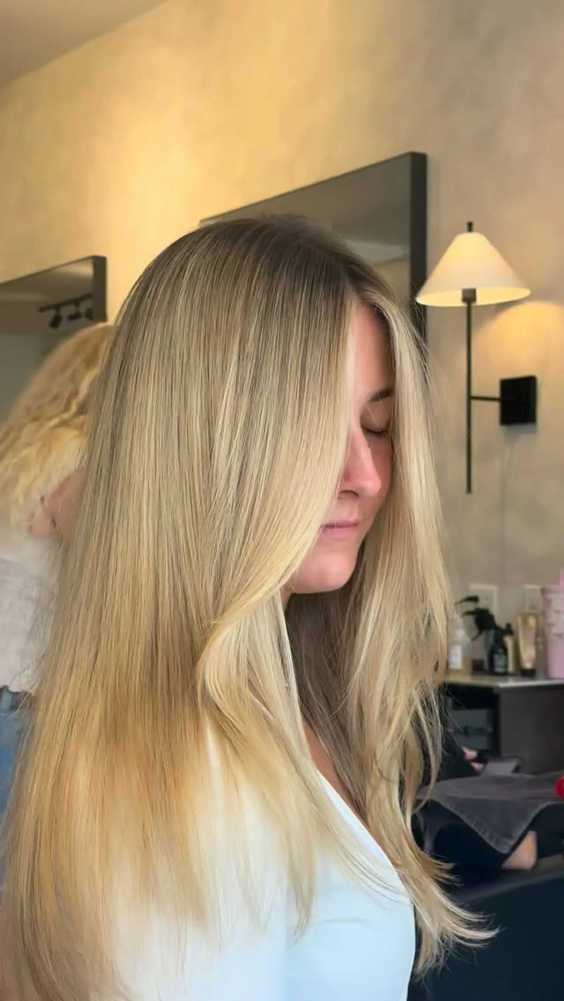 Long, flowing blonde hair styled straight with a gentle bend and soft face-framing pieces. 1